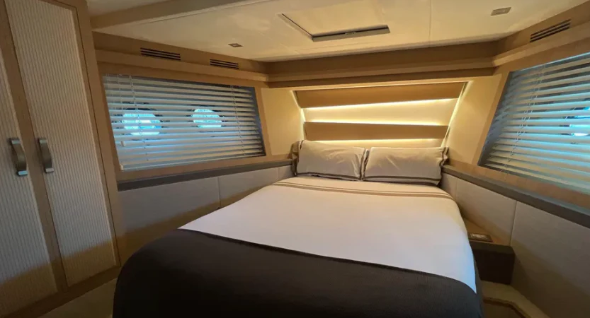 a person sitting on a bed aboard CRAZY DIAMOND Yacht for Sale