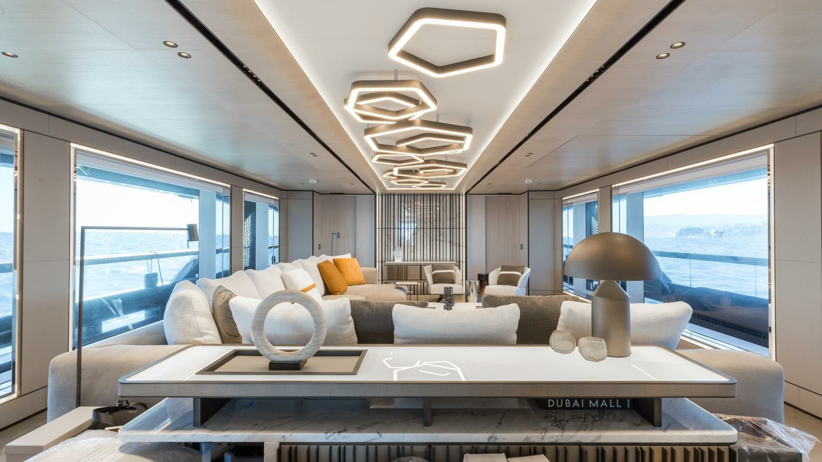 a living room with a large window aboard AKULA Yacht for Charter