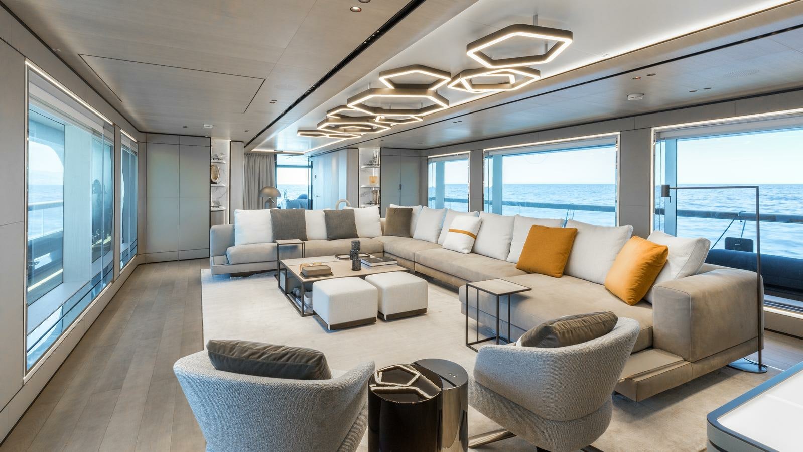 a living room with a large window aboard AKULA Yacht for Charter
