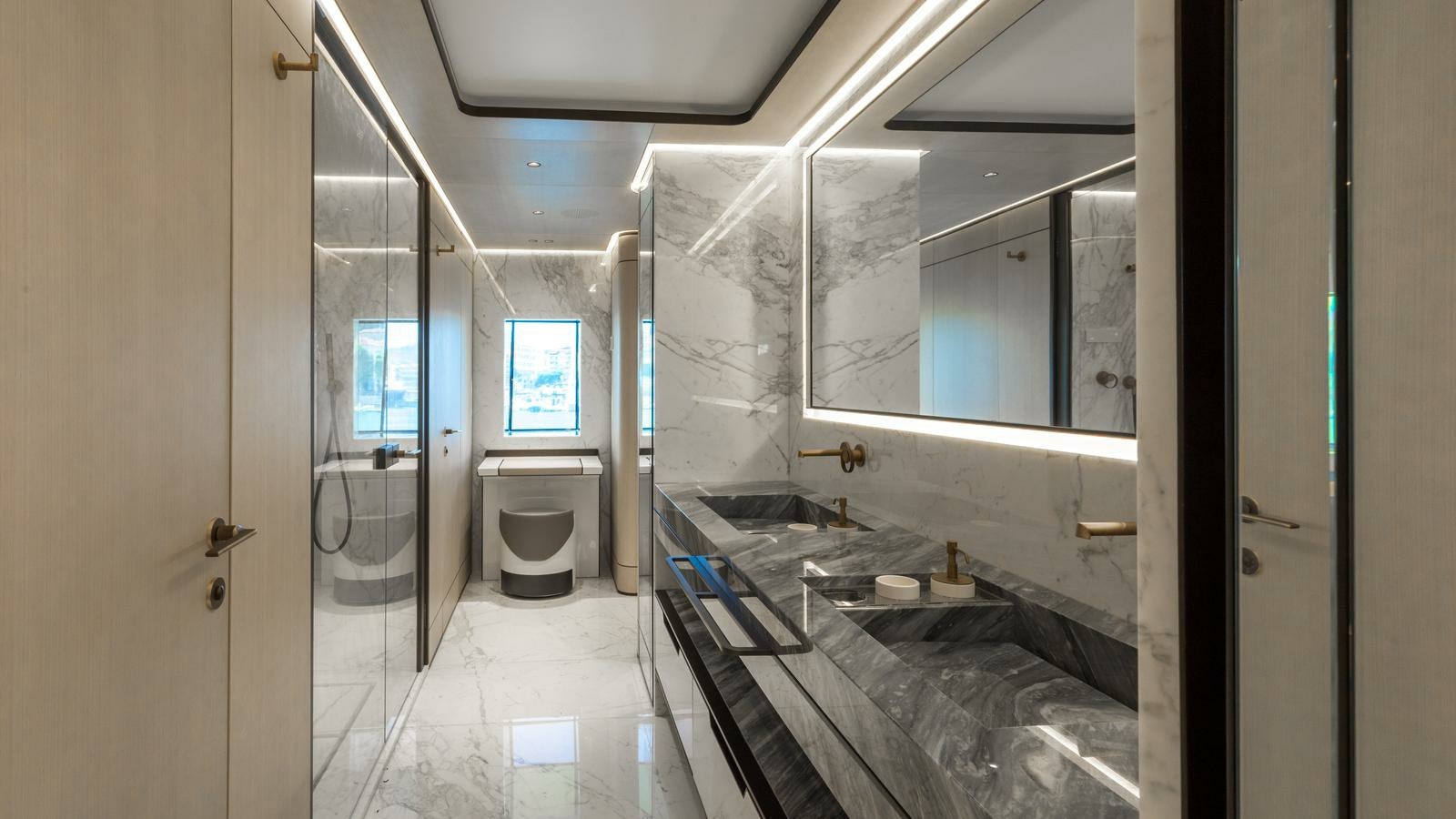 a bathroom with a glass shower aboard AKULA Yacht for Charter