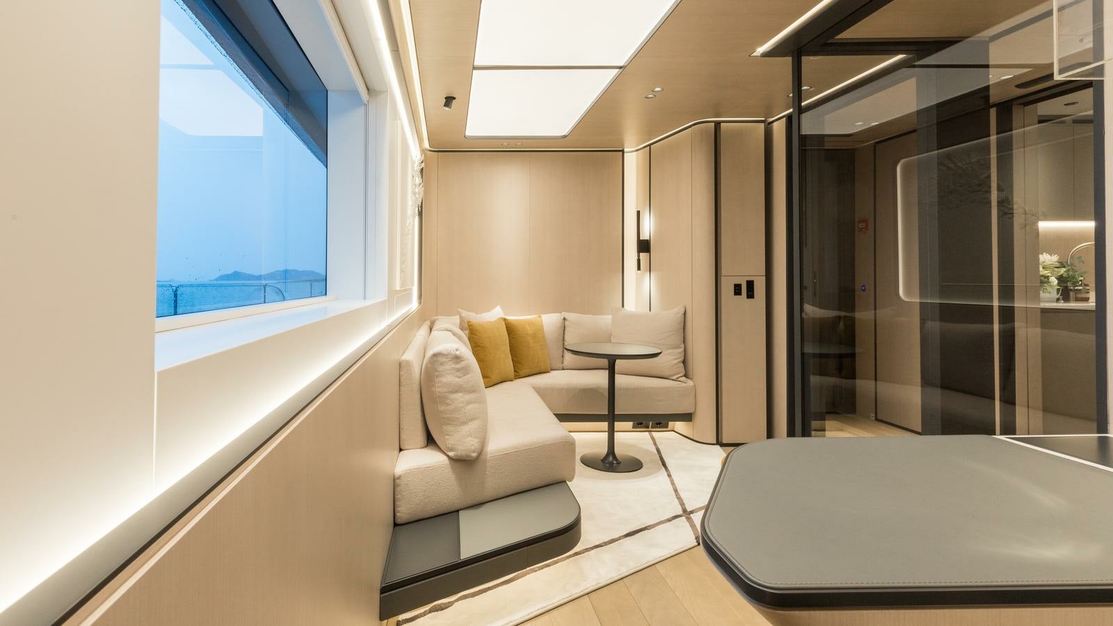 a room with a couch and a table aboard AKULA Yacht for Charter
