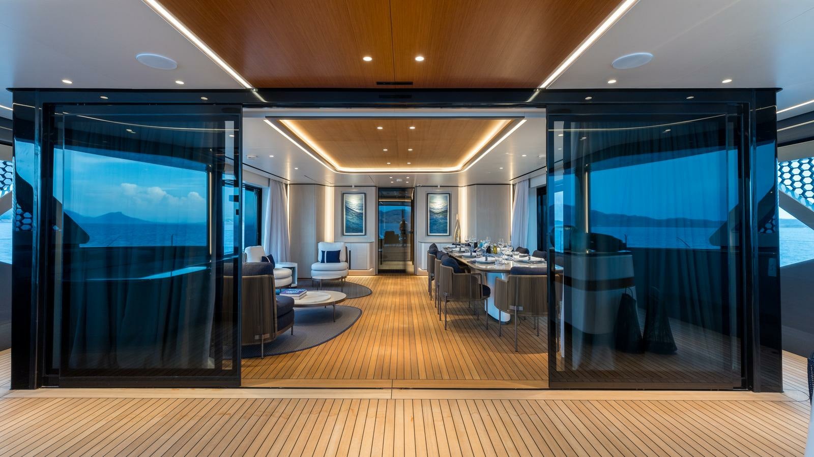 a large room with a large glass wall and a large window aboard AKULA Yacht for Charter