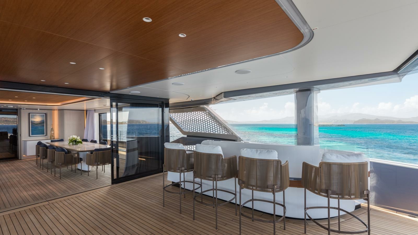 a large room with a large swimming pool and a deck aboard AKULA Yacht for Charter