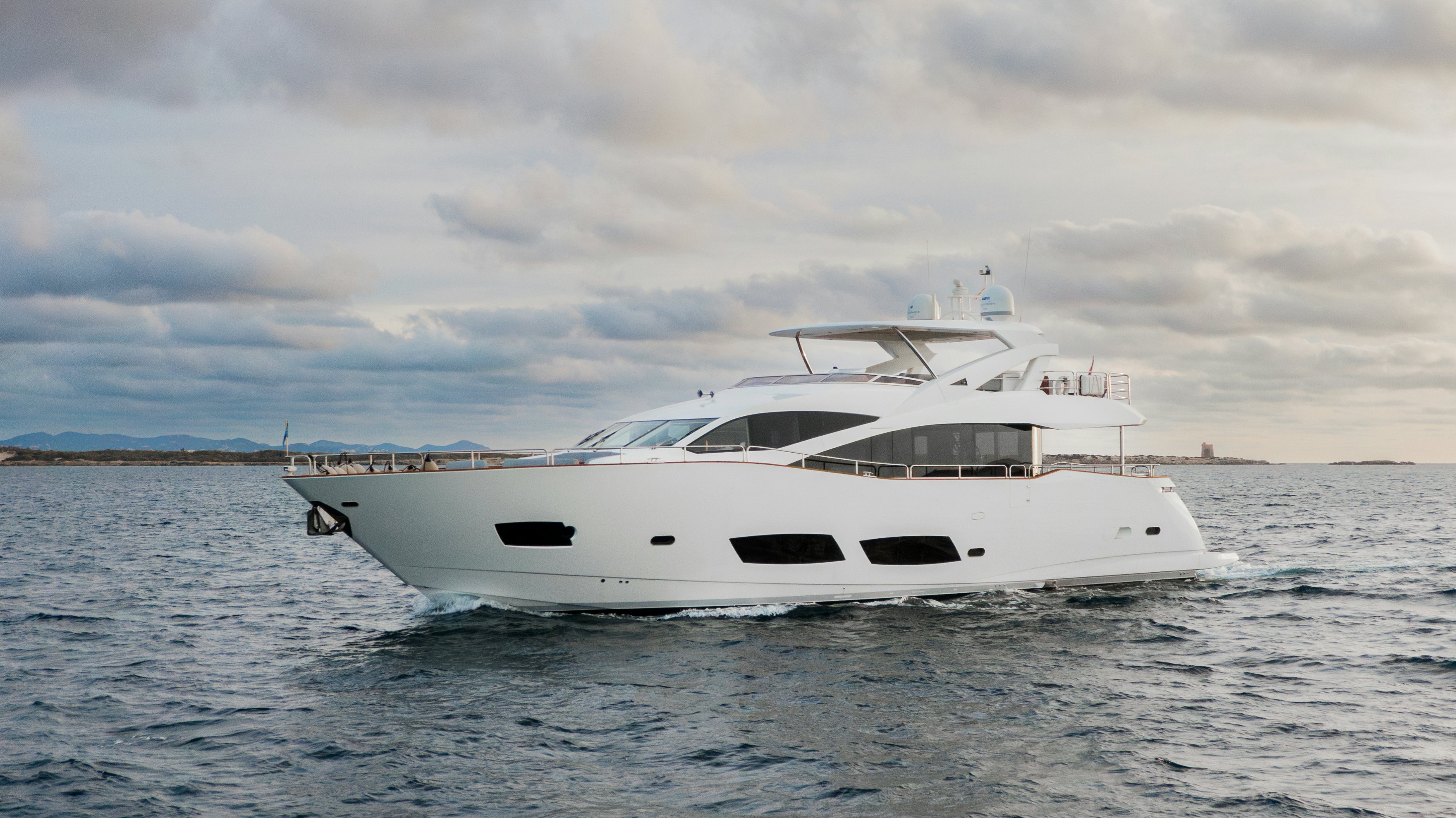 a white yacht in the water aboard PLAY THE GAME Yacht for Sale