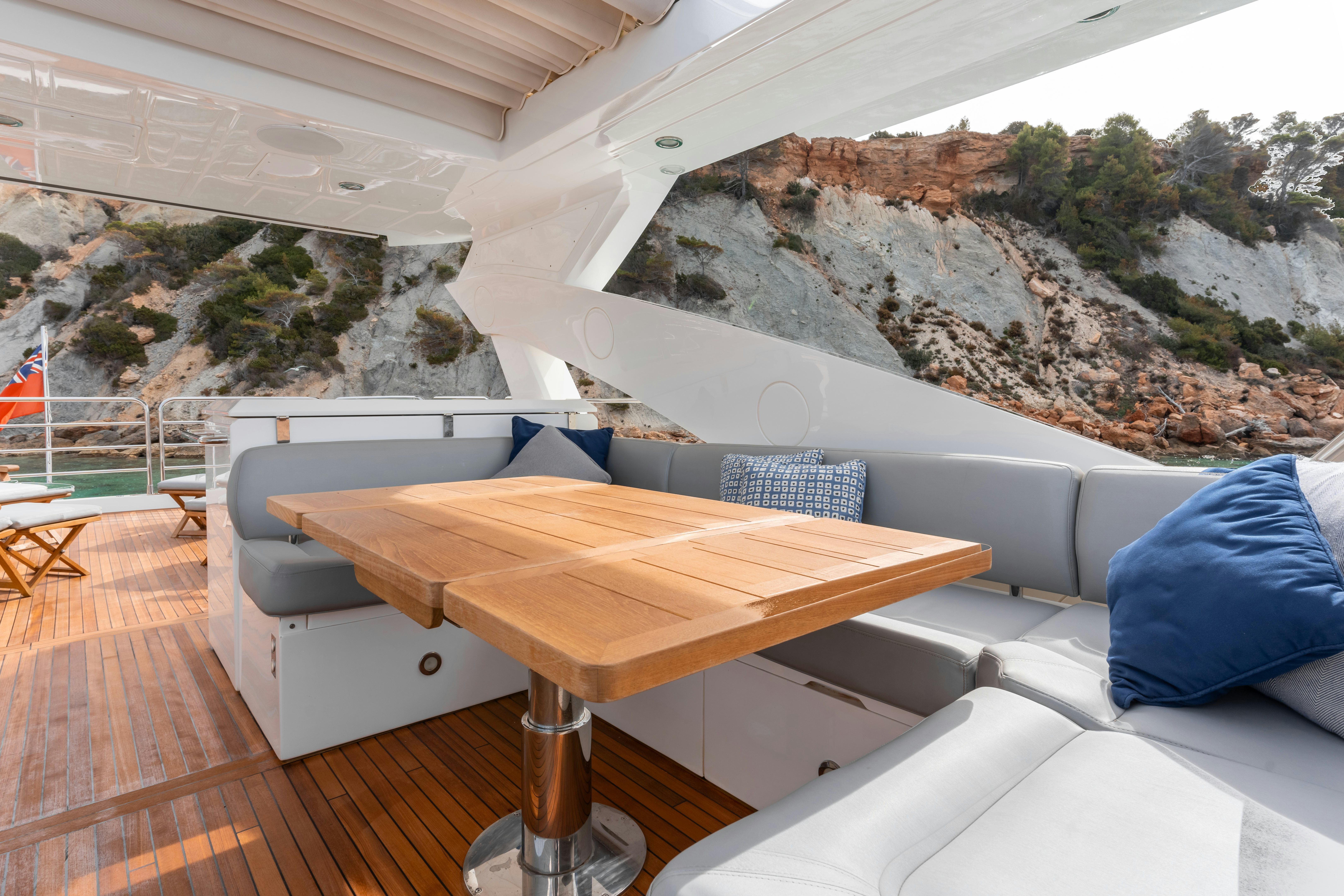 a table and couch in a room aboard PLAY THE GAME Yacht for Sale