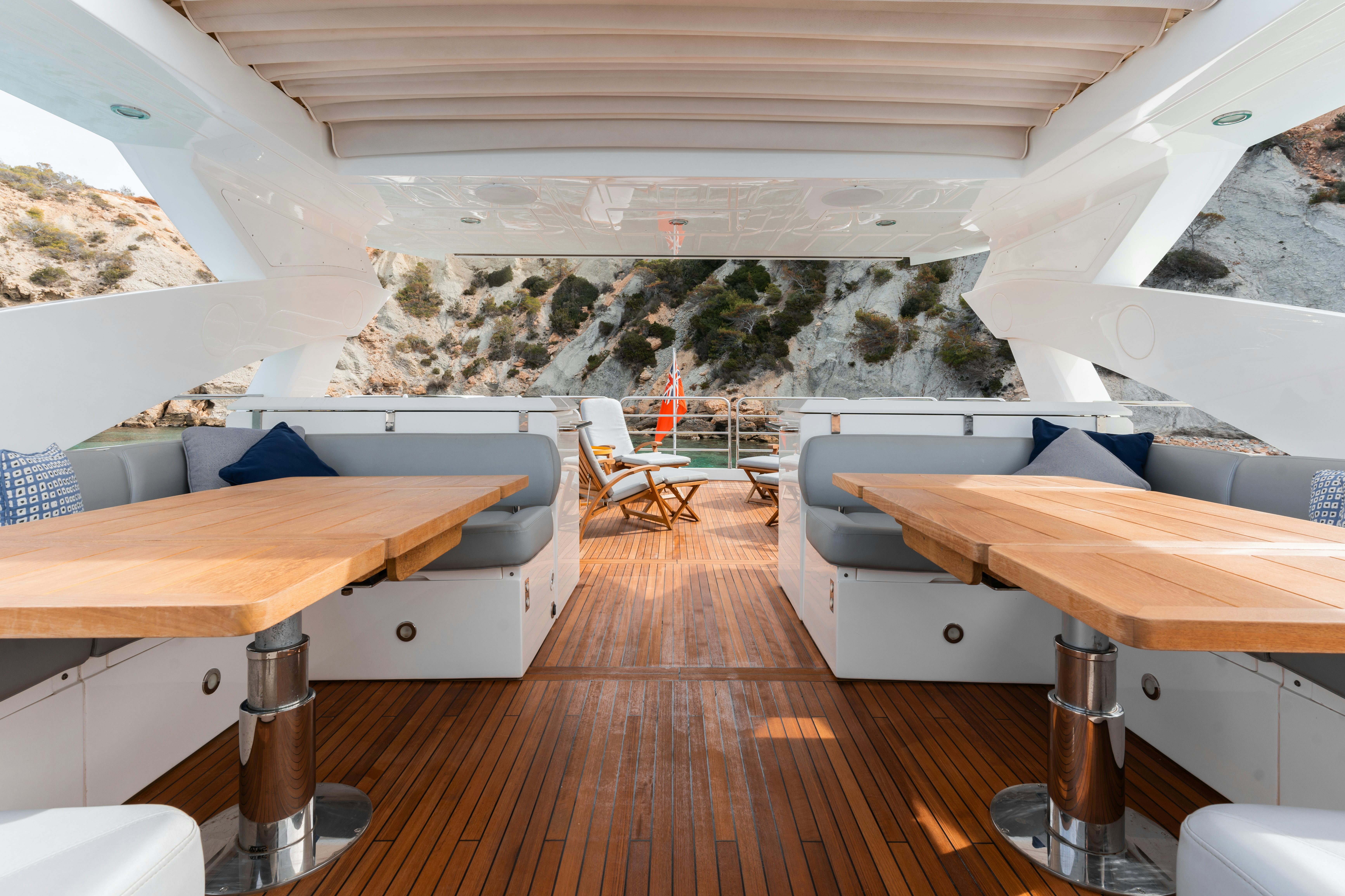 a room with a table and chairs aboard PLAY THE GAME Yacht for Sale
