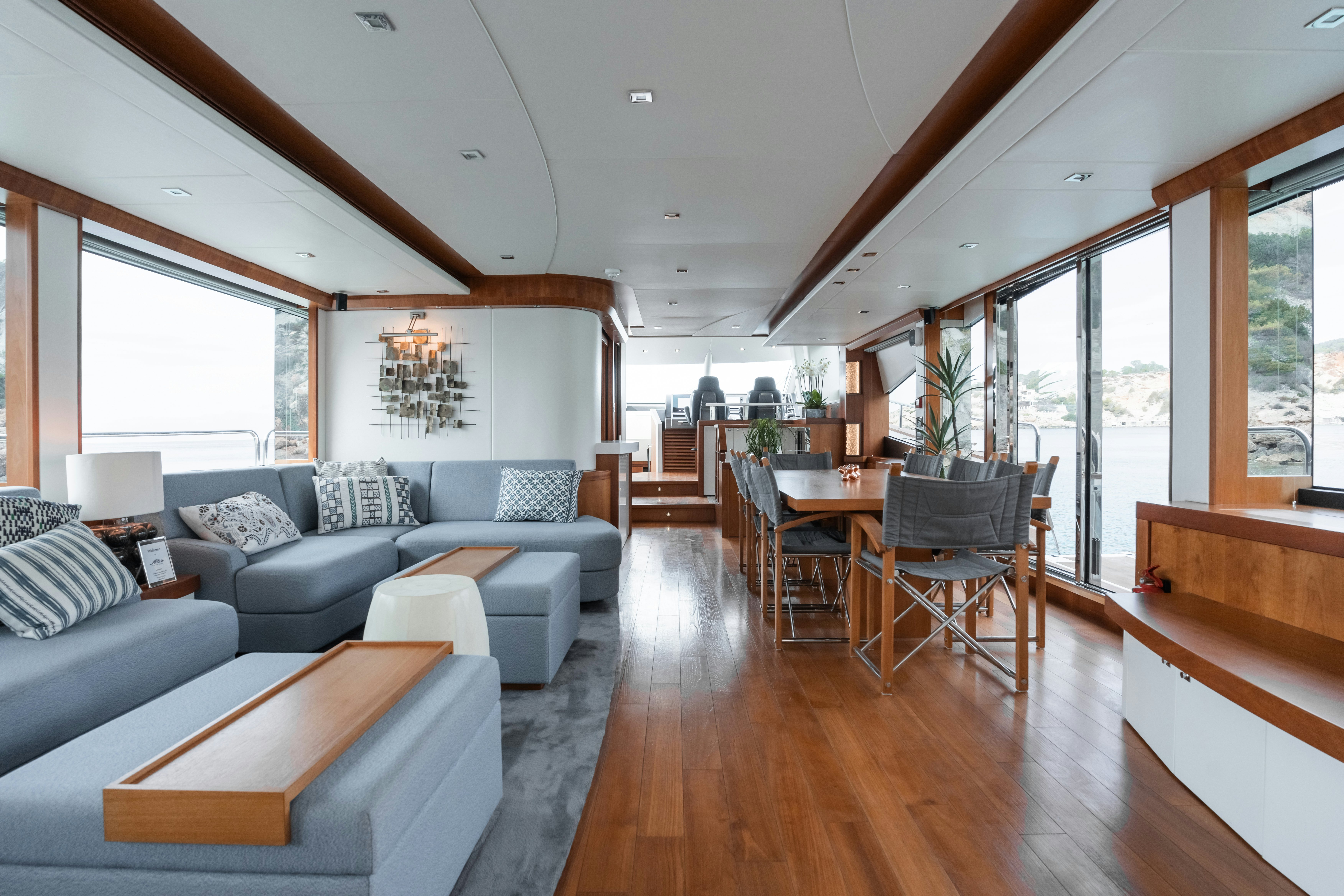 a living room with a wood floor aboard PLAY THE GAME Yacht for Sale