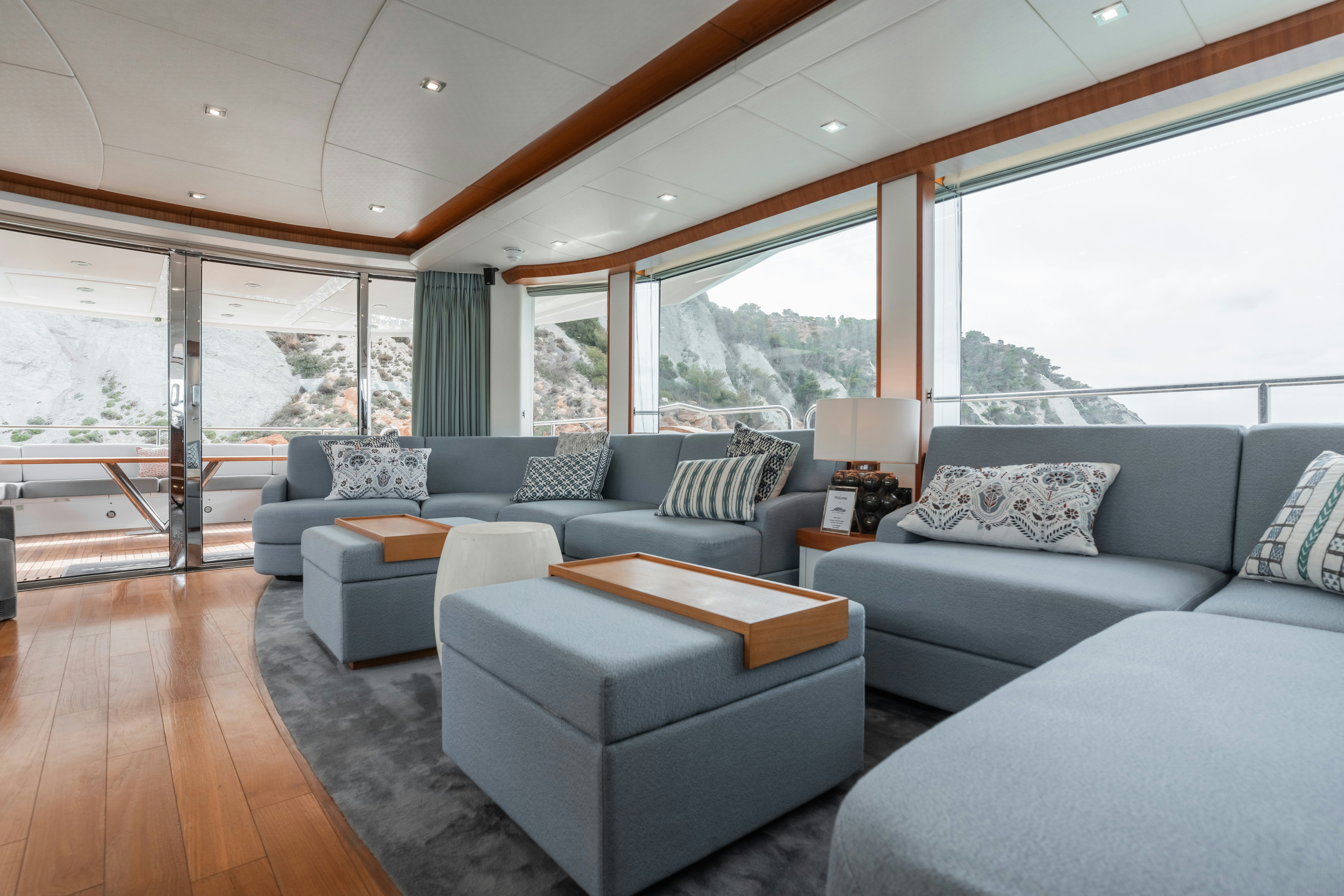 a living room with a large window aboard PLAY THE GAME Yacht for Sale