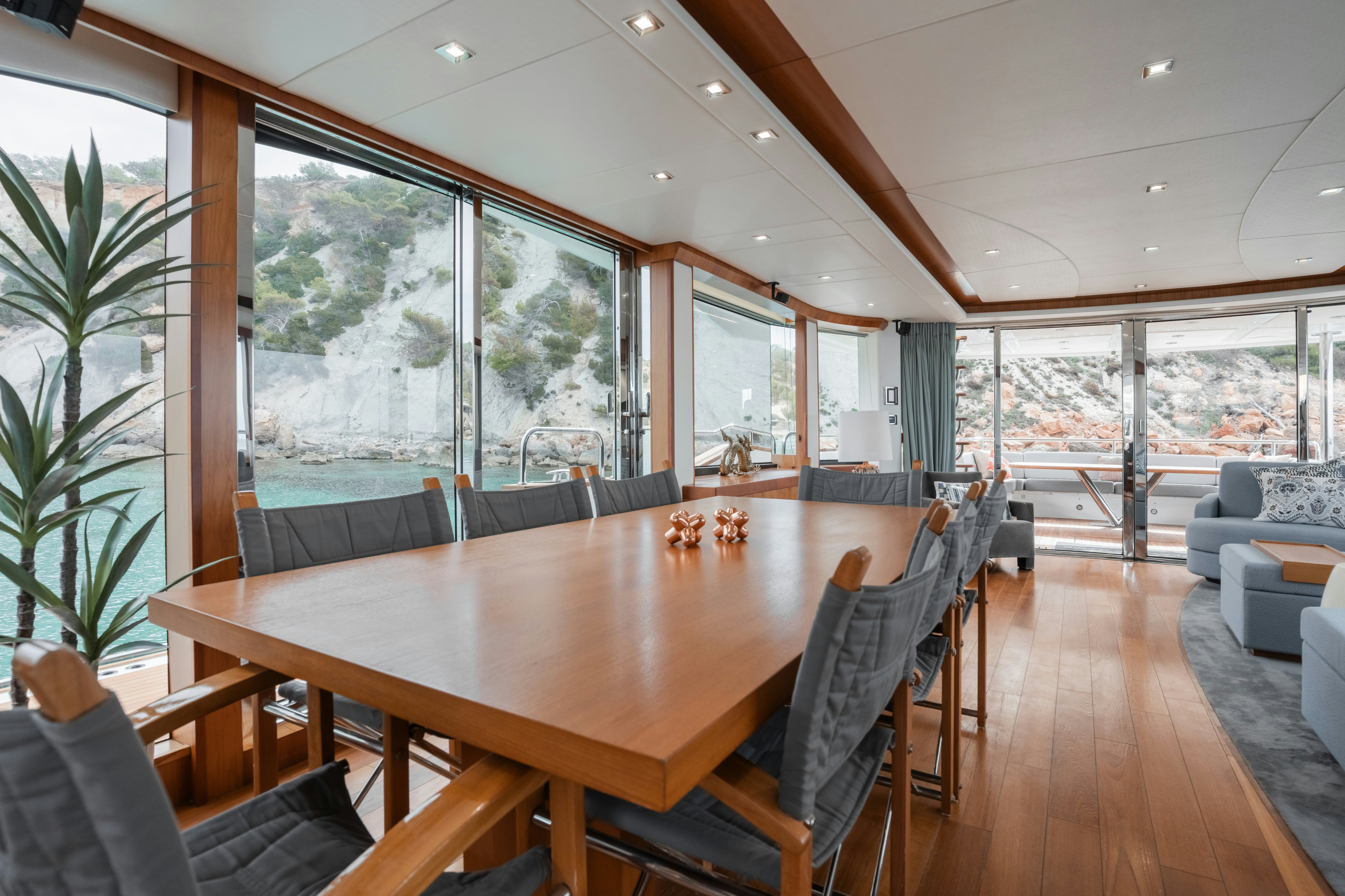 a large dining table in a room aboard PLAY THE GAME Yacht for Sale