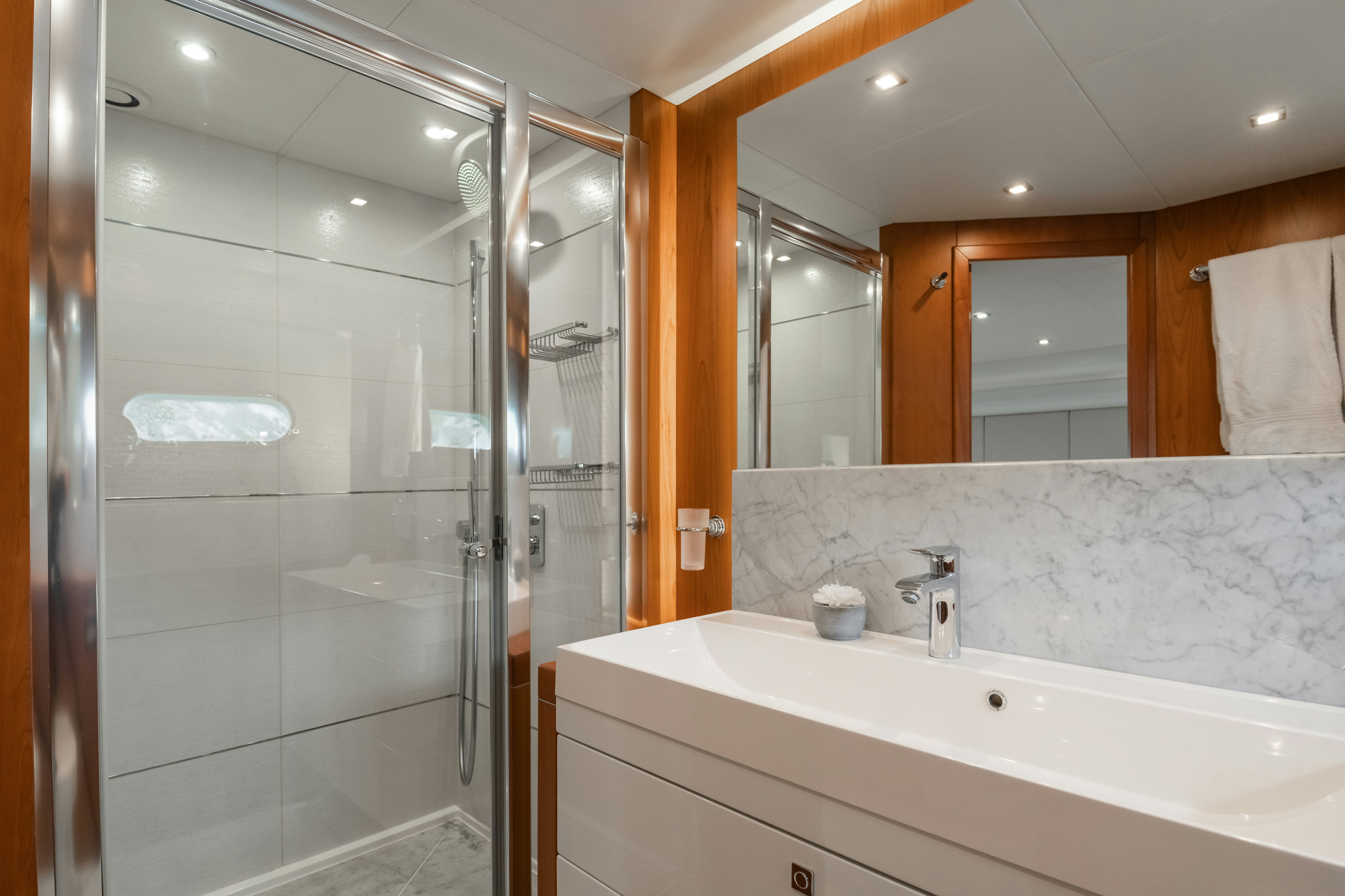 a bathroom with a glass shower aboard PLAY THE GAME Yacht for Sale