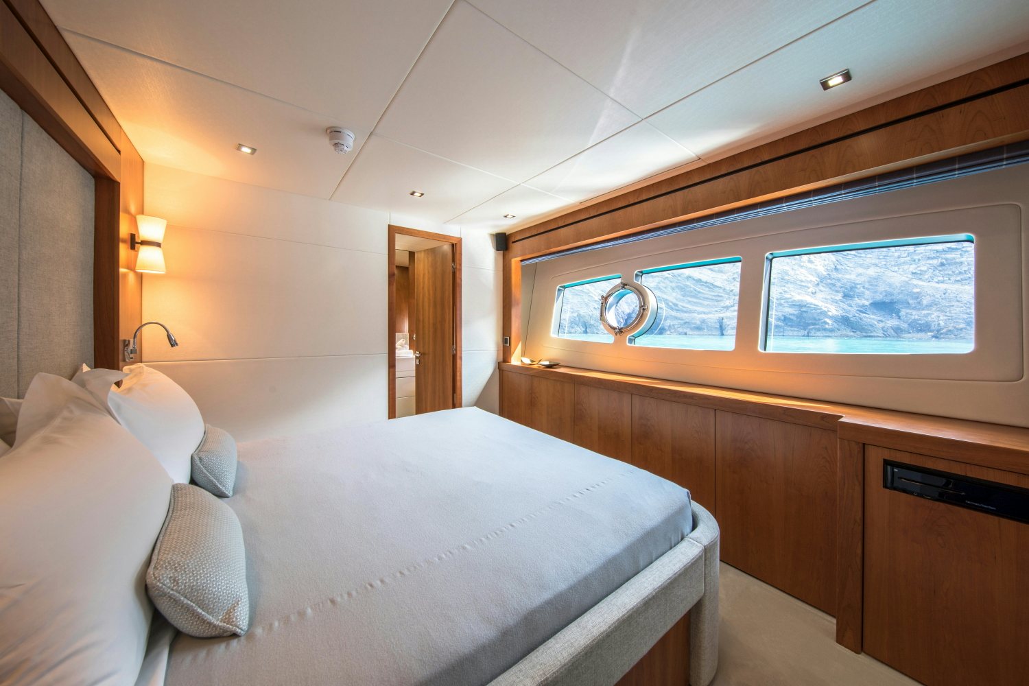a room with a bed and a window aboard PLAY THE GAME Yacht for Sale