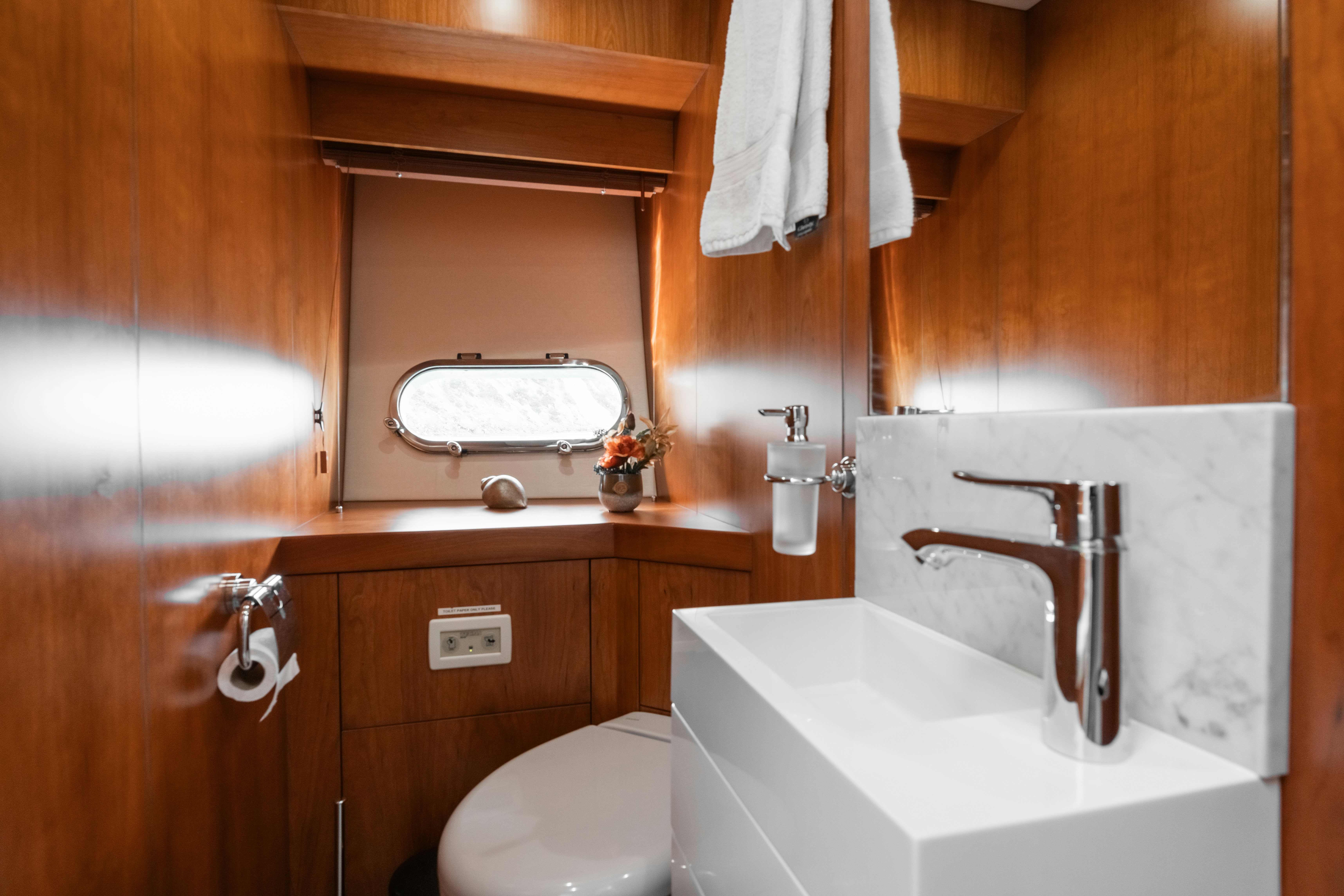 a bathroom with a sink and toilet aboard PLAY THE GAME Yacht for Sale