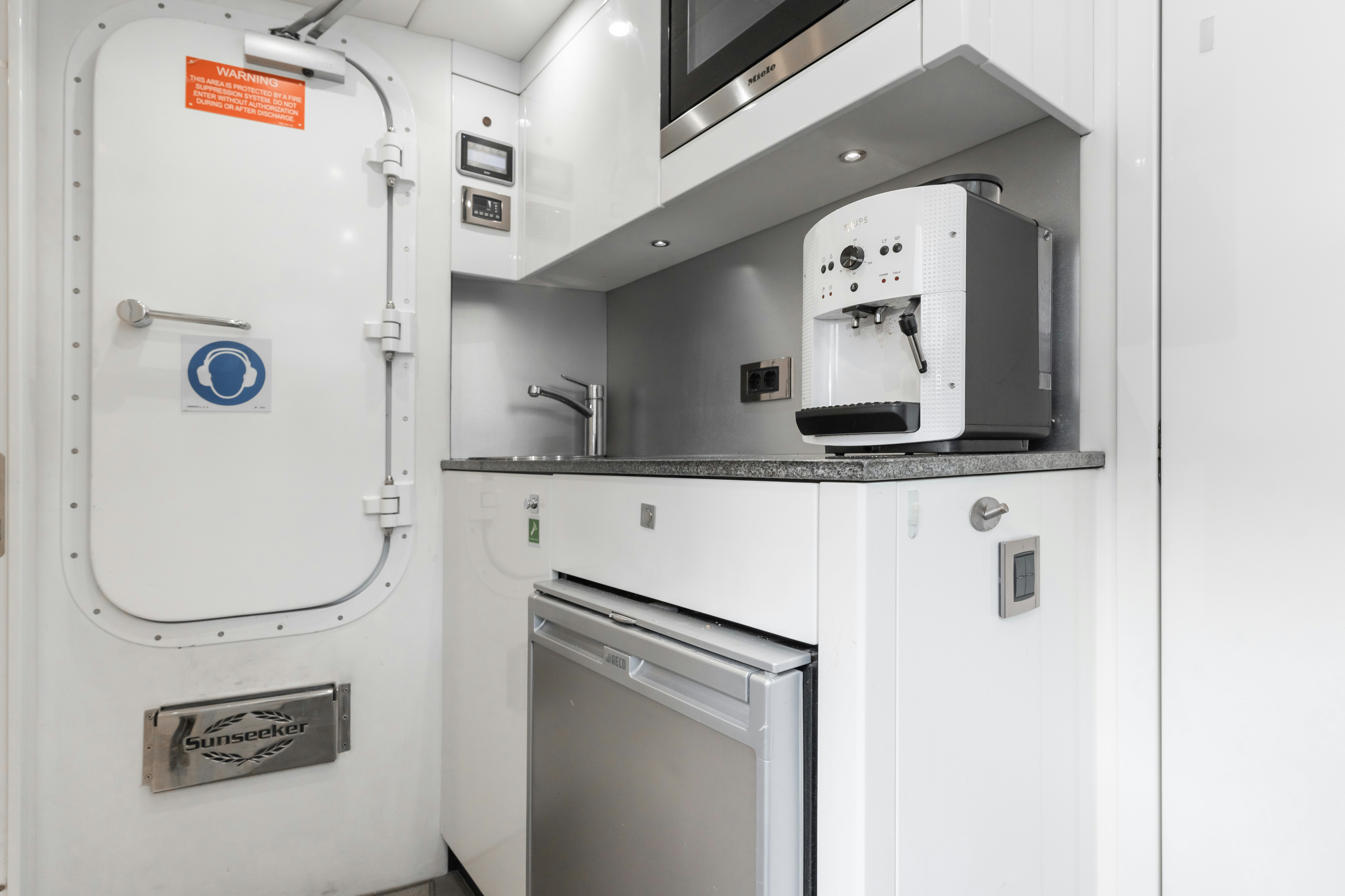 a white machine with a light on it aboard PLAY THE GAME Yacht for Sale