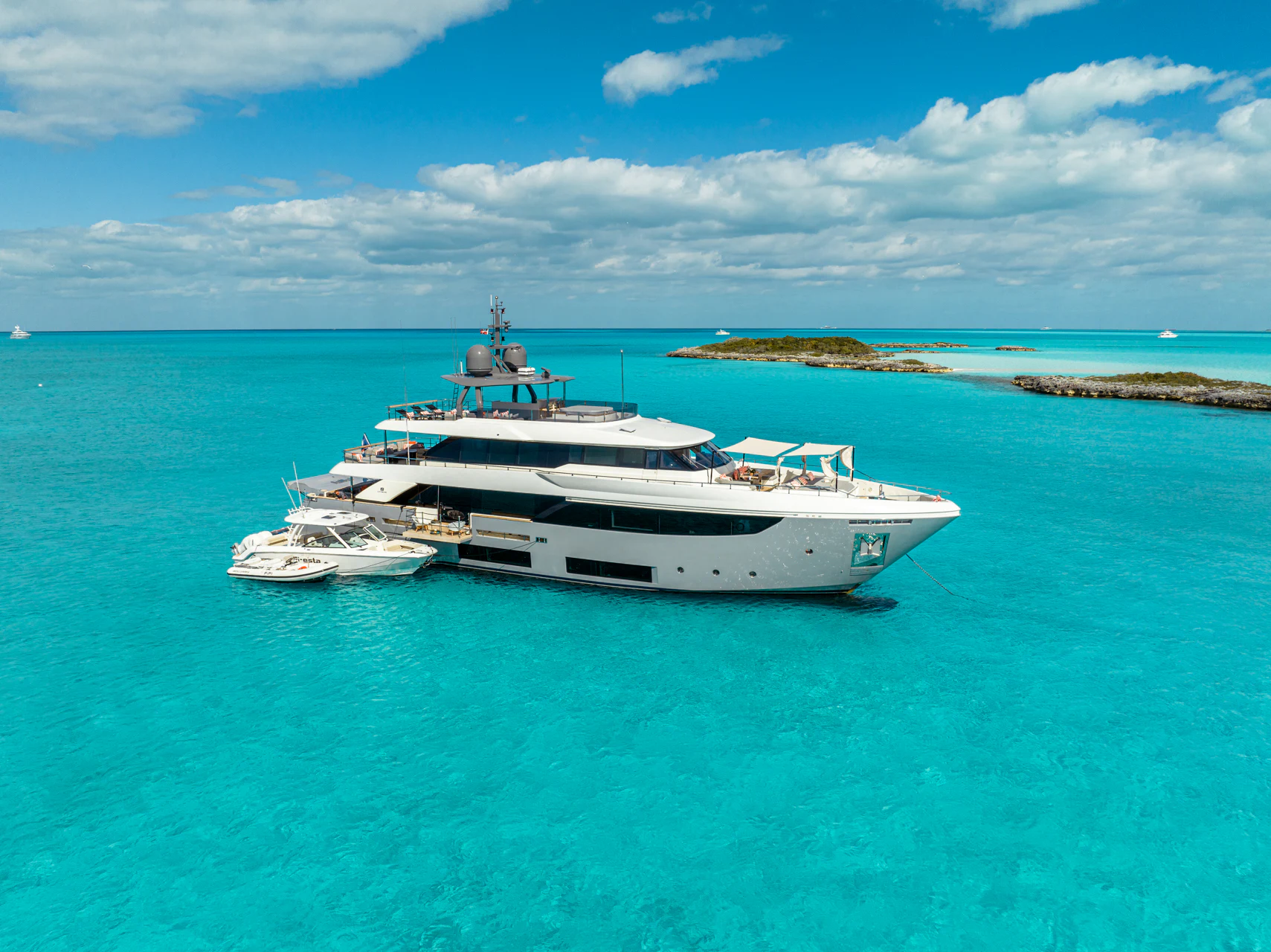 a couple of boats in the water aboard FIFI Yacht for Charter