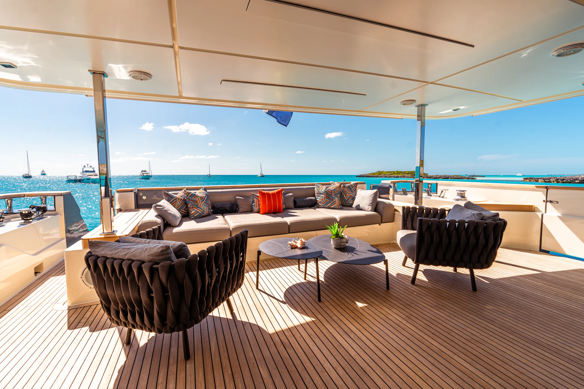 a living room with a large ocean aboard FIFI Yacht for Charter