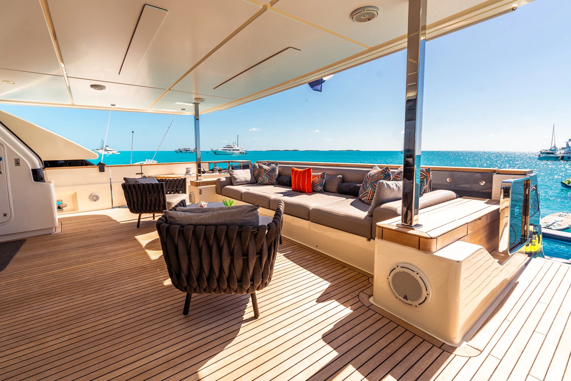 a large living room with a large balcony overlooking the ocean aboard FIFI Yacht for Charter