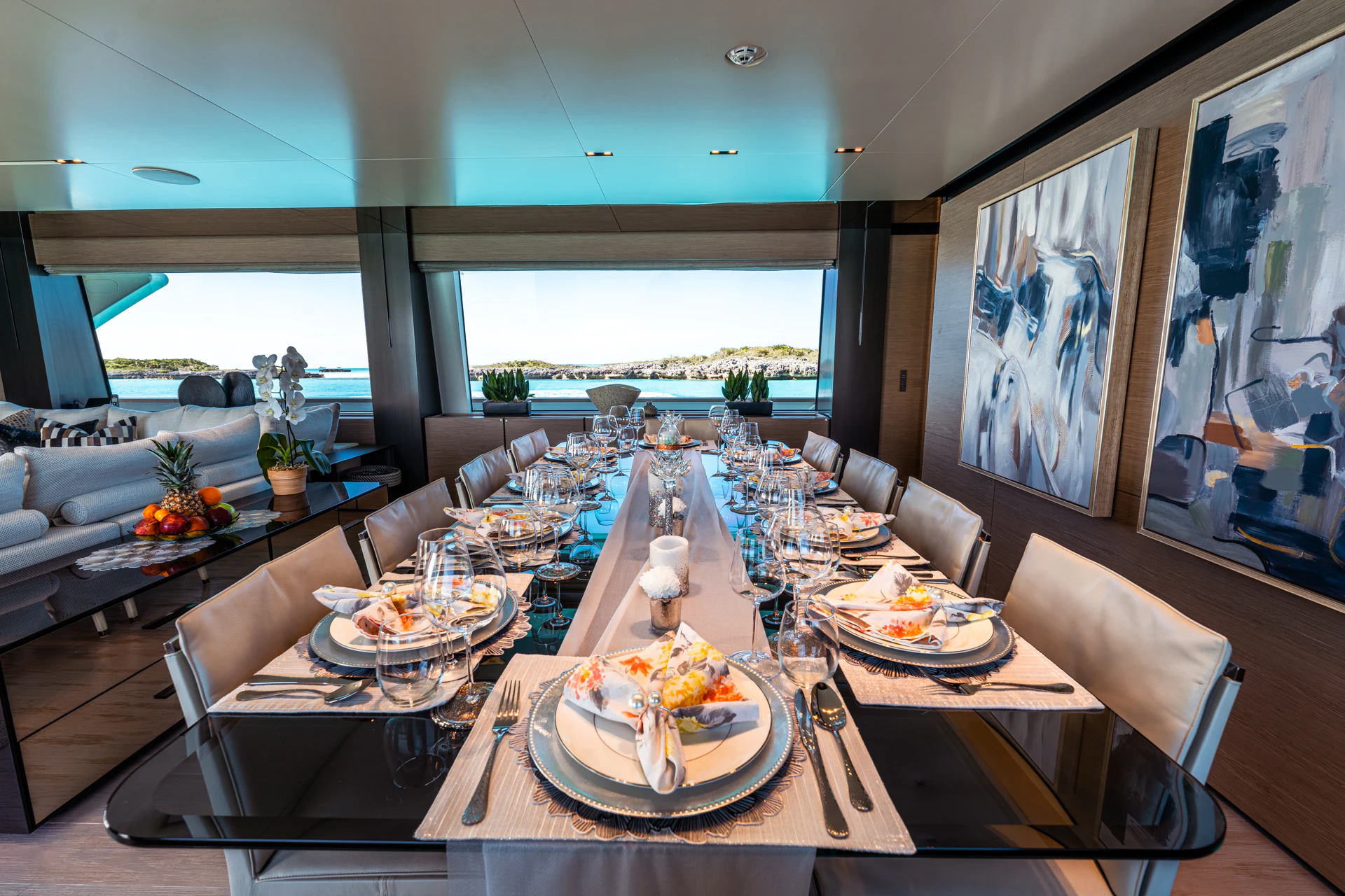 a large dining room with a large window aboard FIFI Yacht for Charter