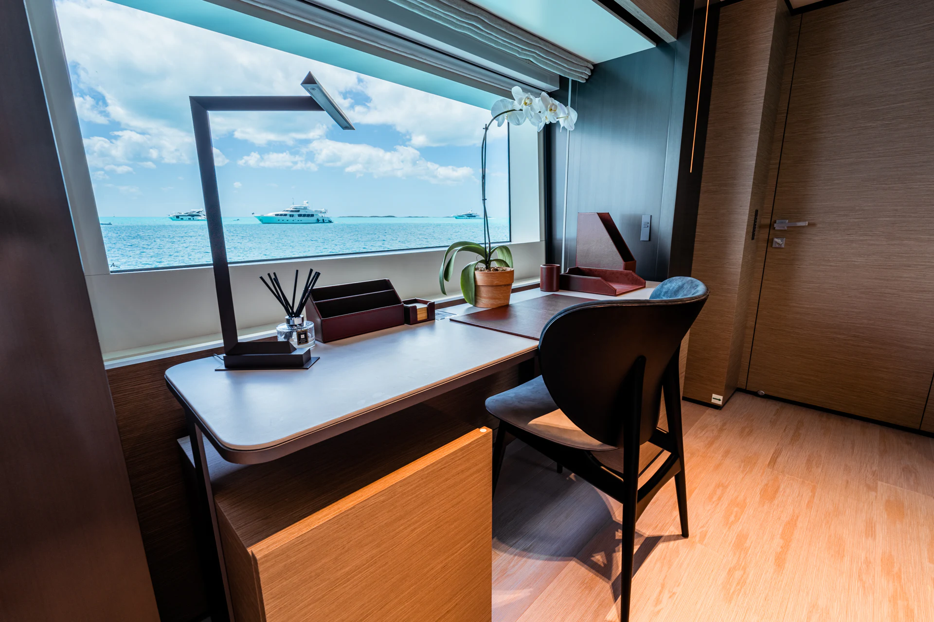 a room with a table and chairs aboard FIFI Yacht for Charter