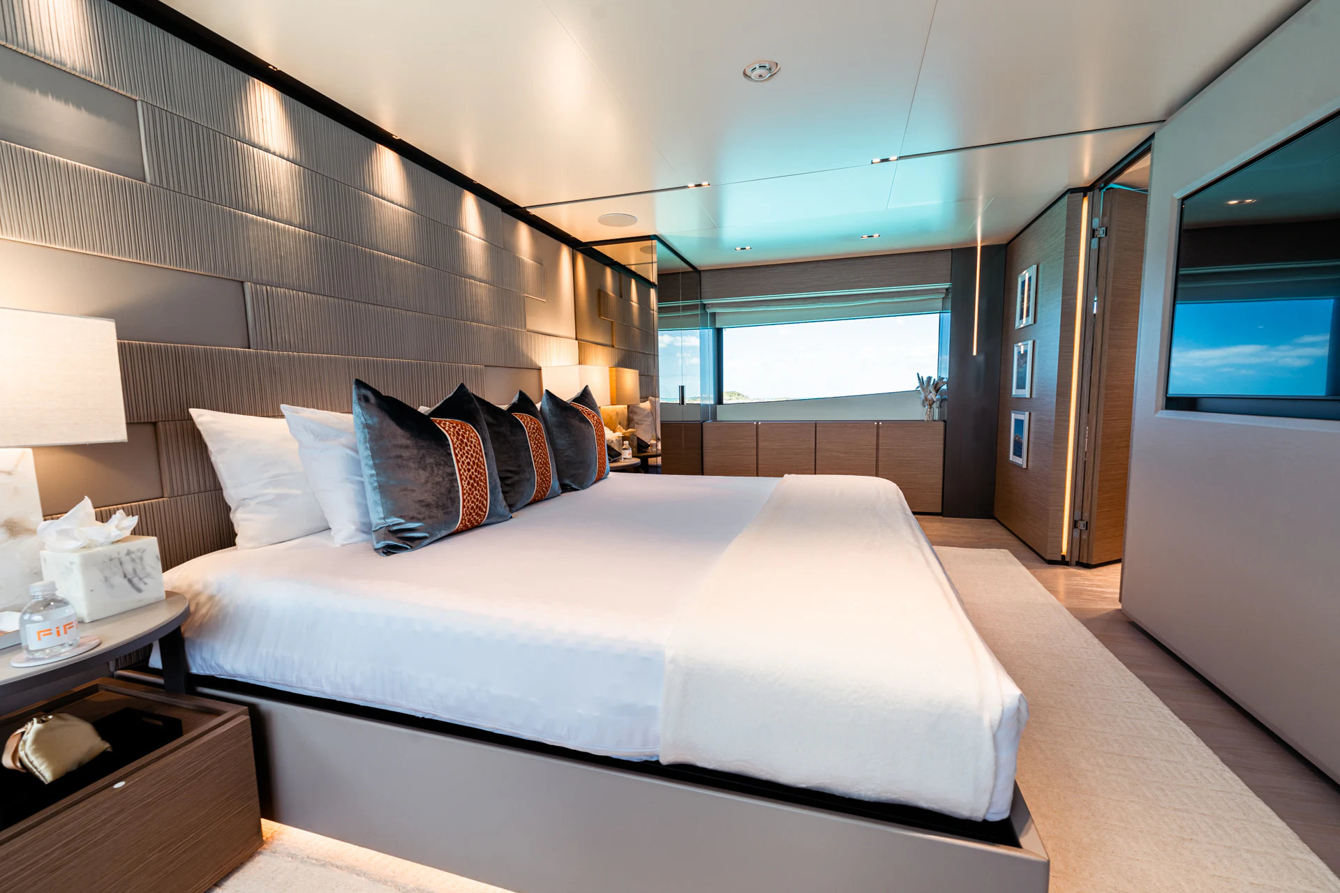 a large bed in a room aboard FIFI Yacht for Charter
