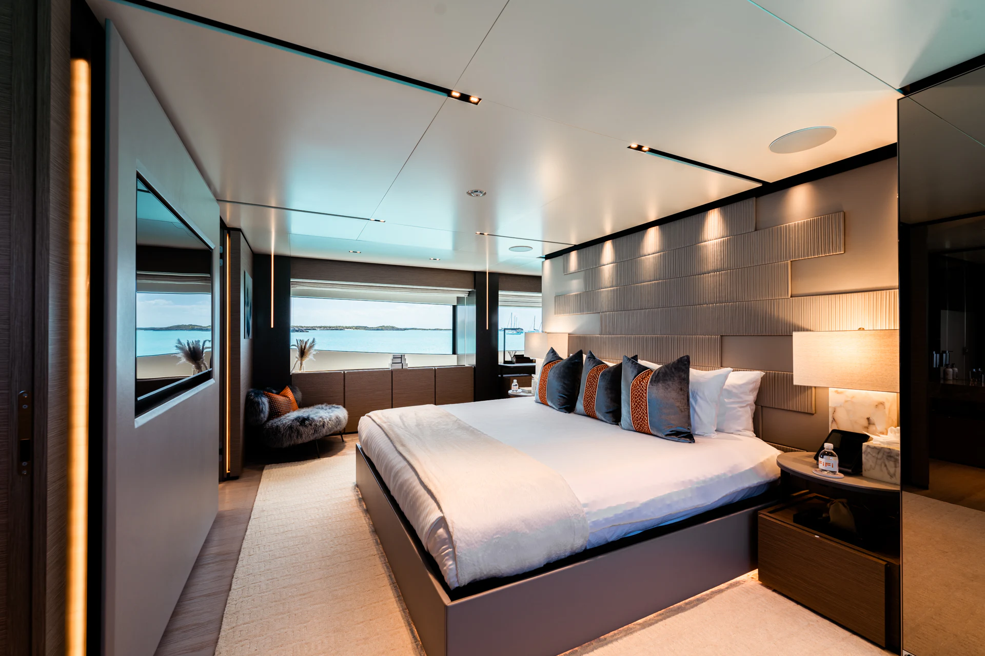 a bedroom with a large bed aboard FIFI Yacht for Charter