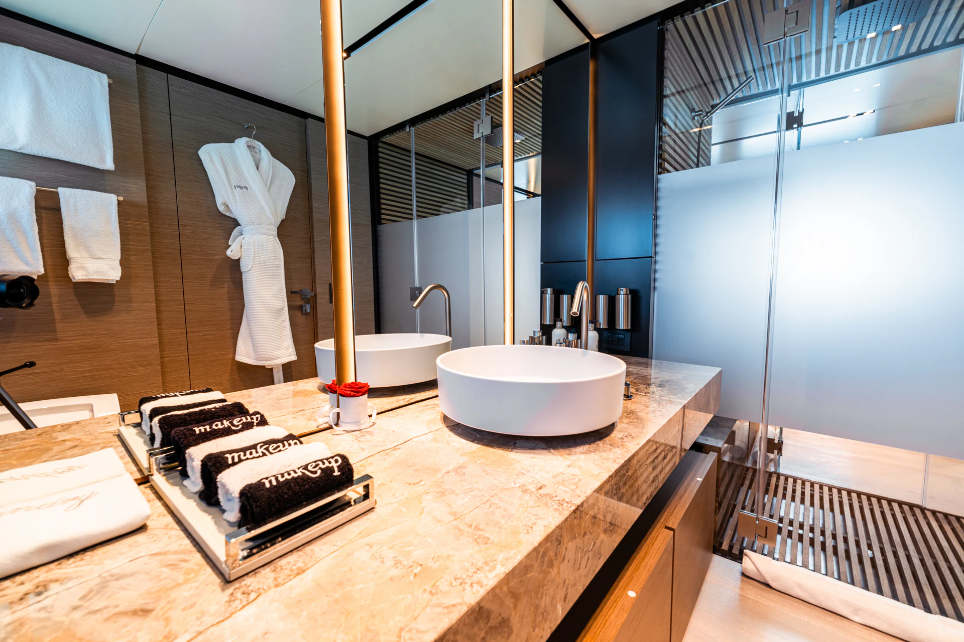 a bathroom with a sink and a mirror aboard FIFI Yacht for Charter