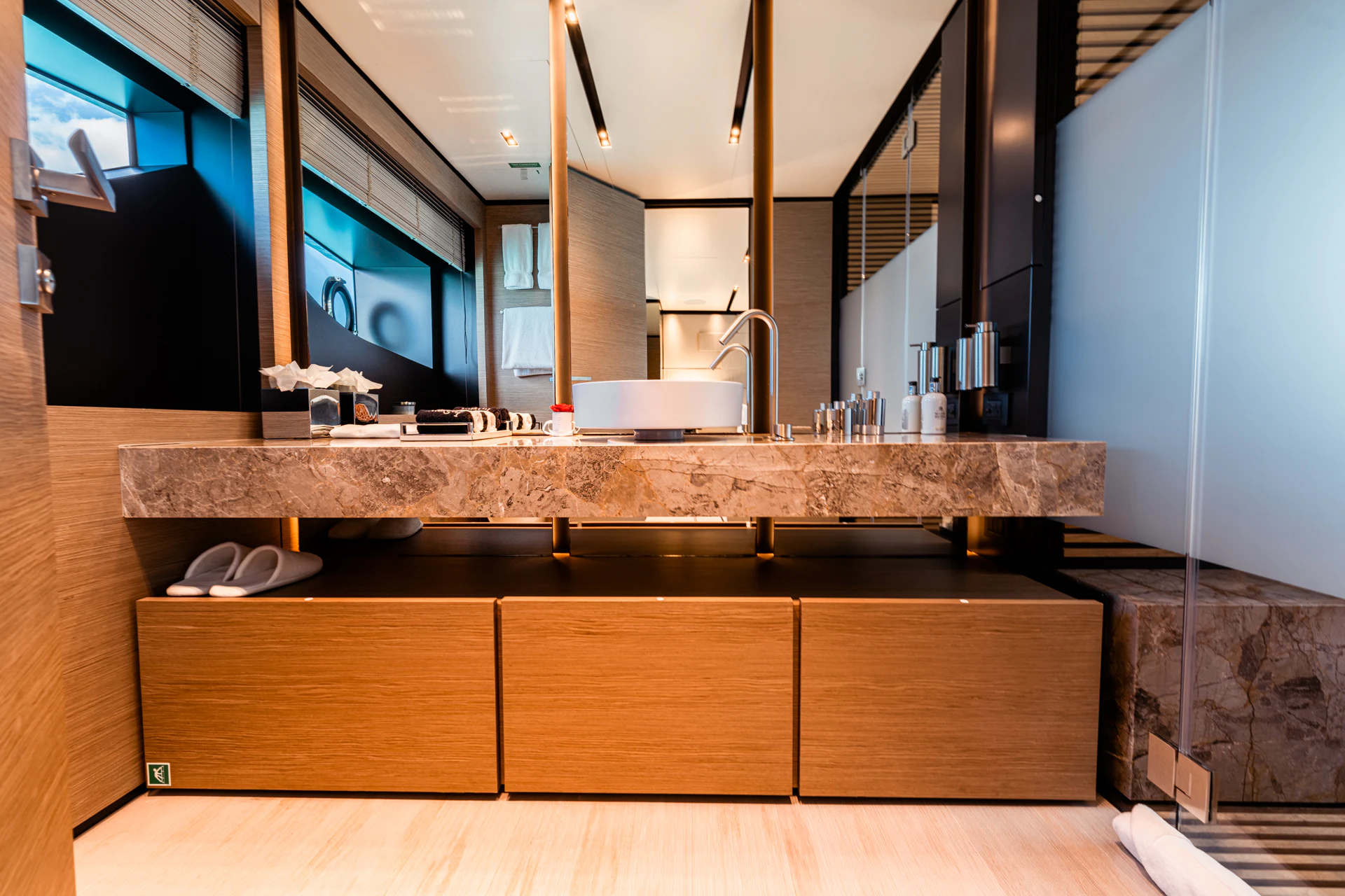 a large bathroom with a large countertop aboard FIFI Yacht for Charter