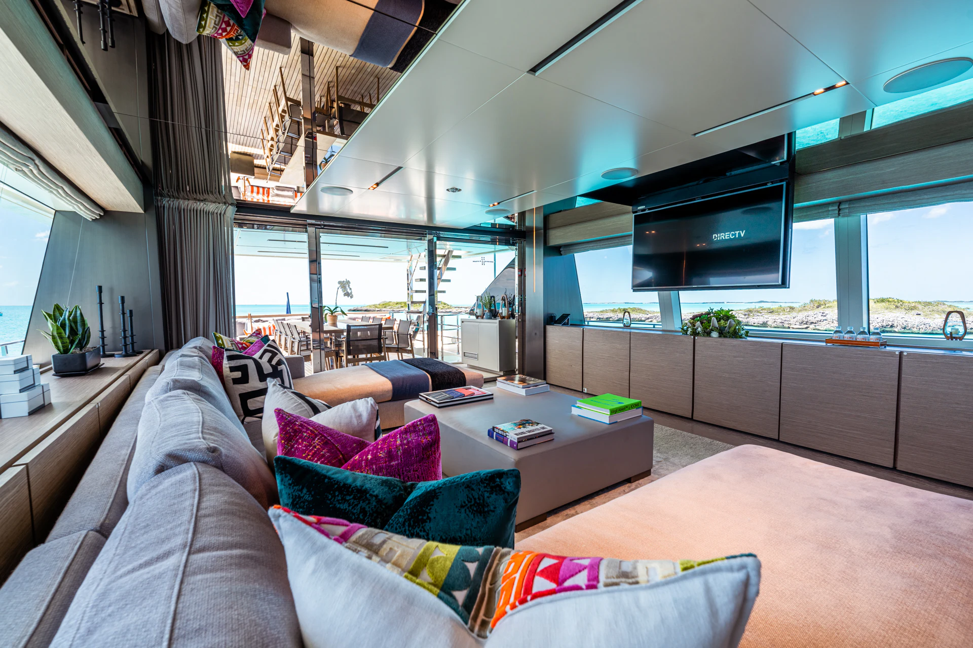 a living room with a large window aboard FIFI Yacht for Charter