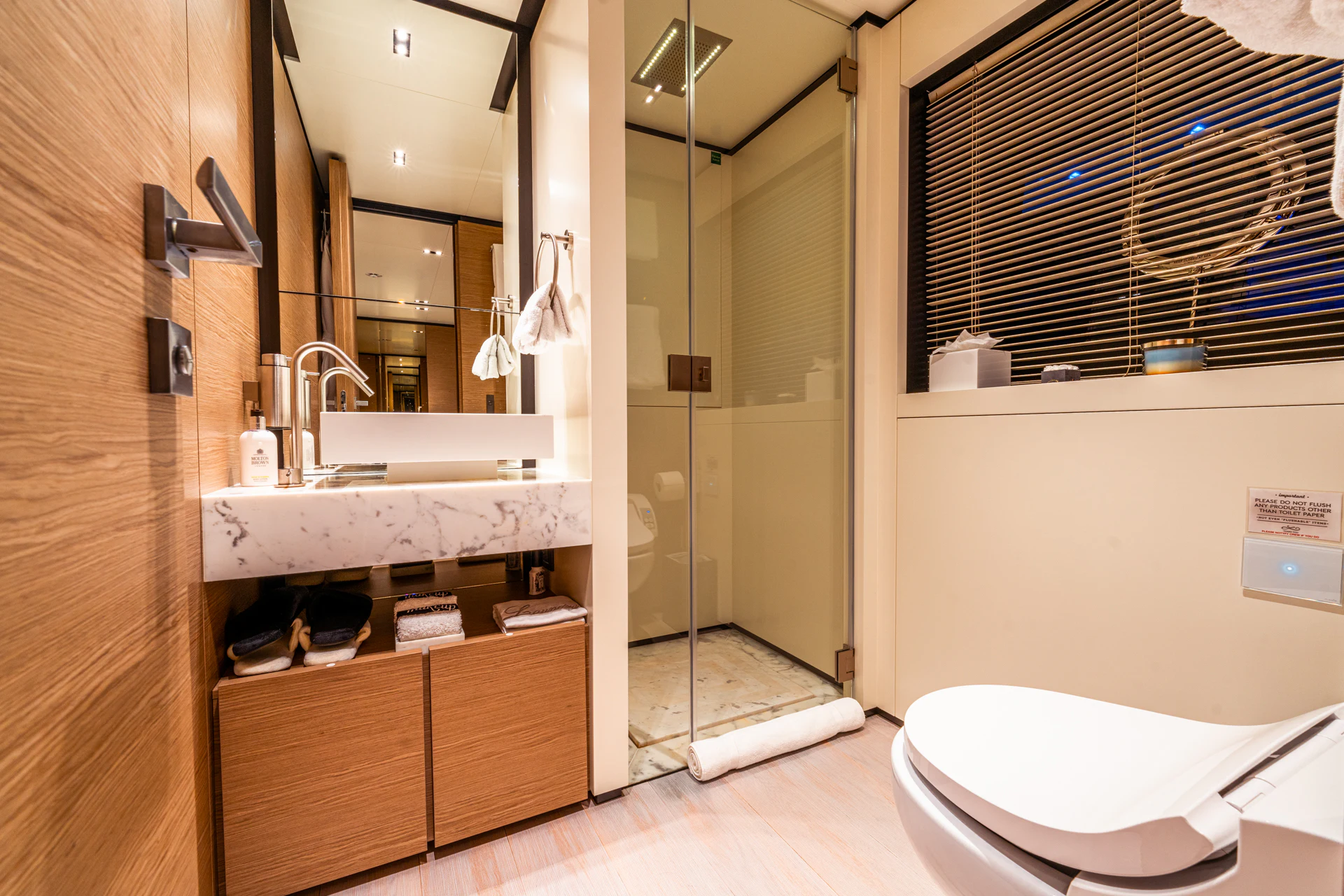 a bathroom with a sink and a toilet aboard FIFI Yacht for Charter