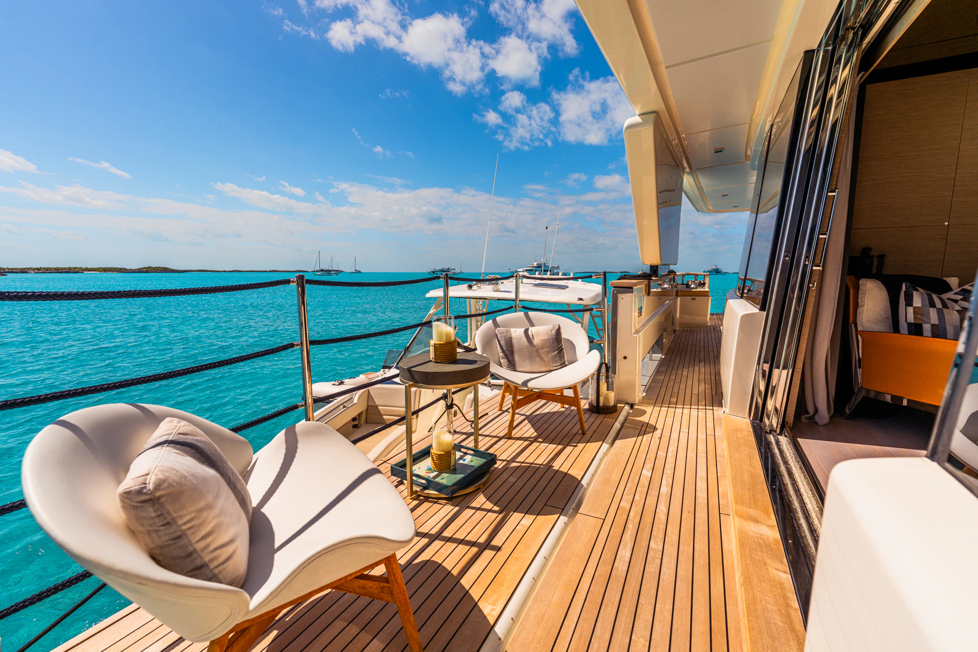 a deck with a view of the ocean and the ocean aboard FIFI Yacht for Charter