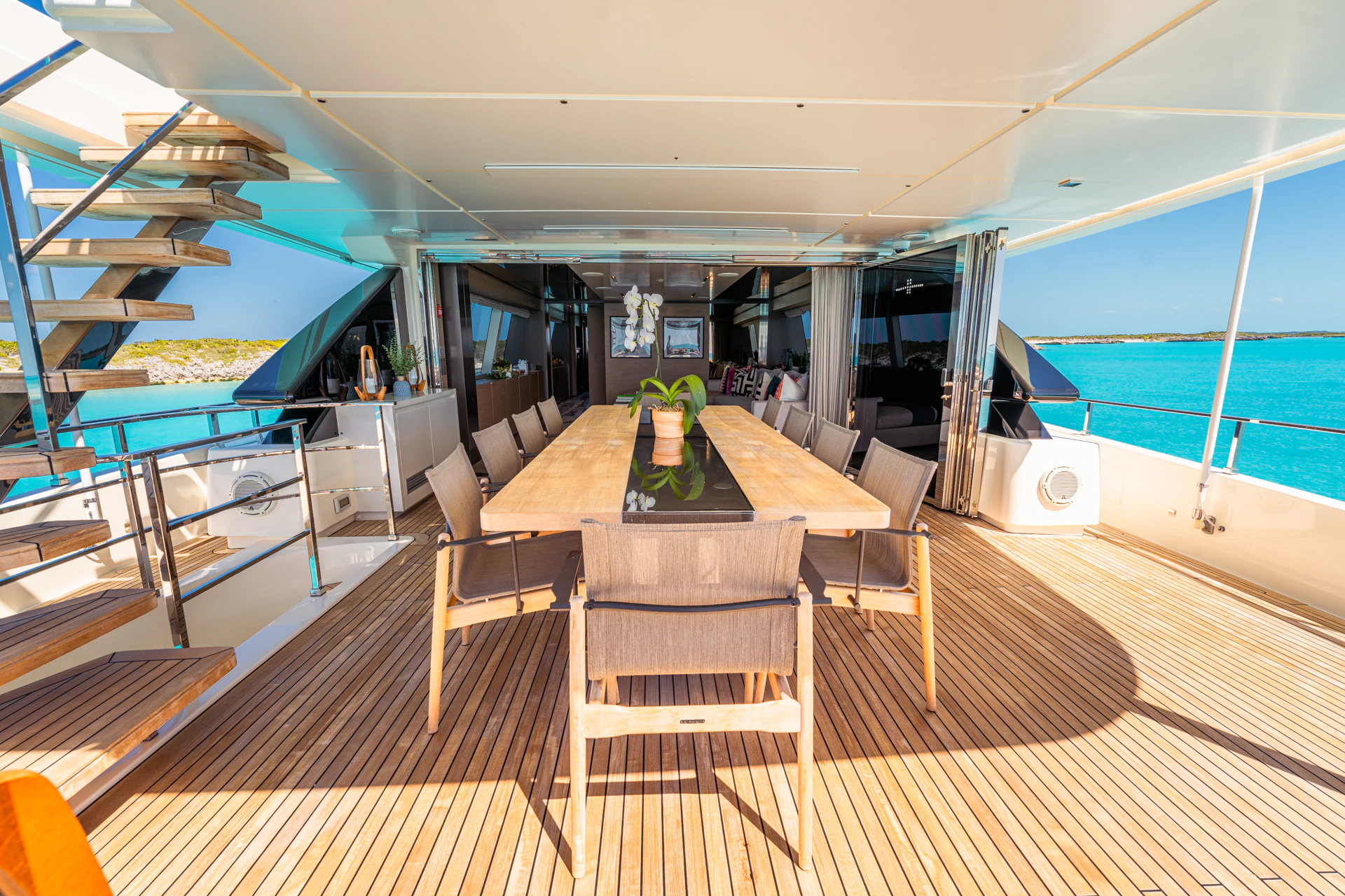 a room with a table and chairs aboard FIFI Yacht for Charter
