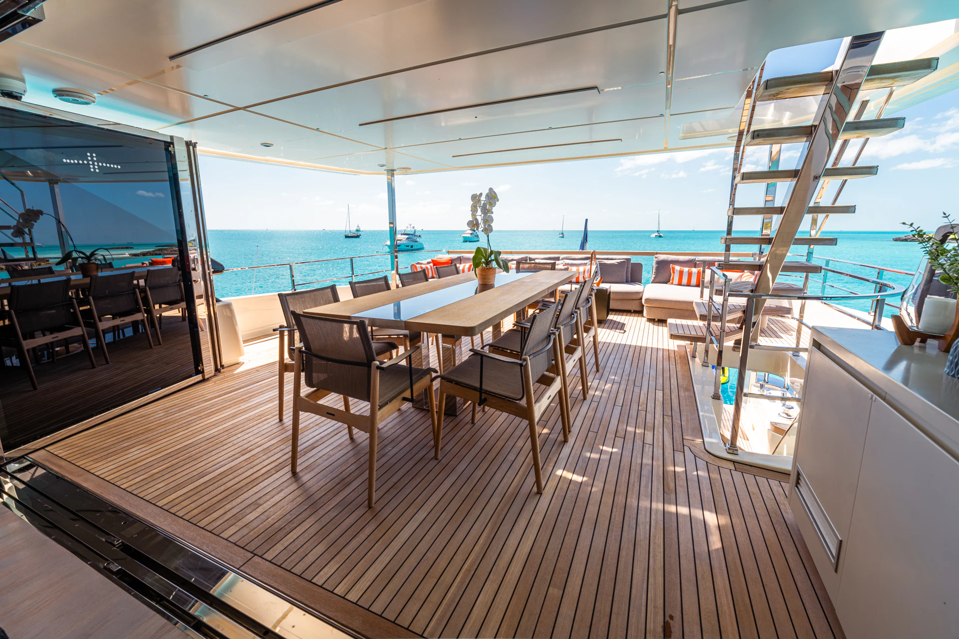 a room with a table and chairs aboard FIFI Yacht for Charter