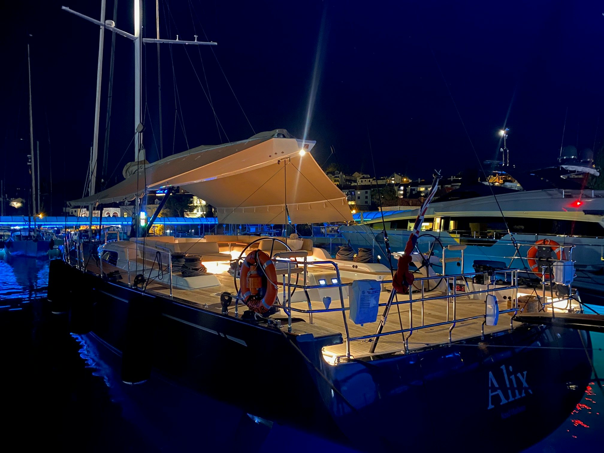 a boat docked at night aboard ALIX Yacht for Sale