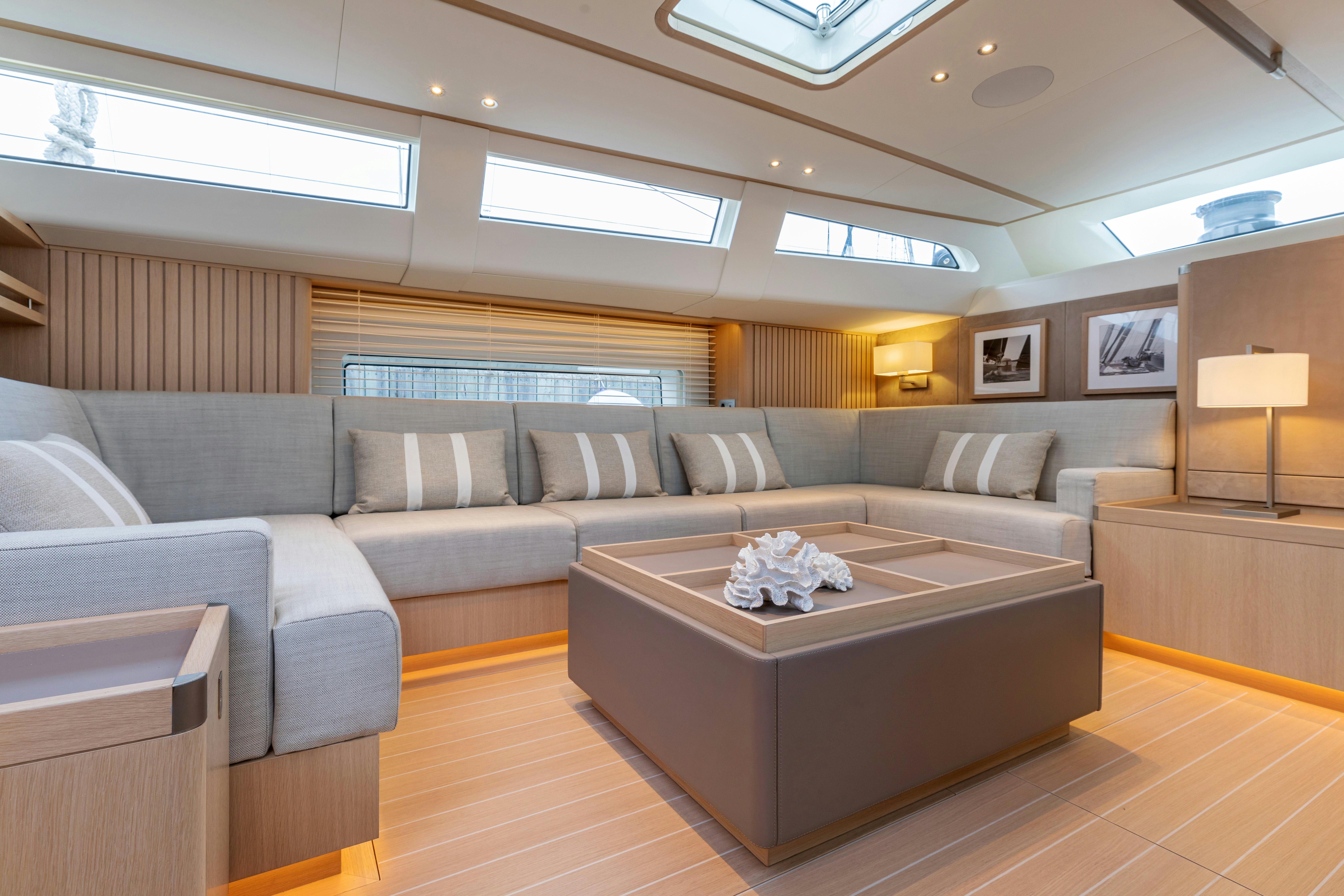 a living room with a couch and a table aboard ALIX Yacht for Sale