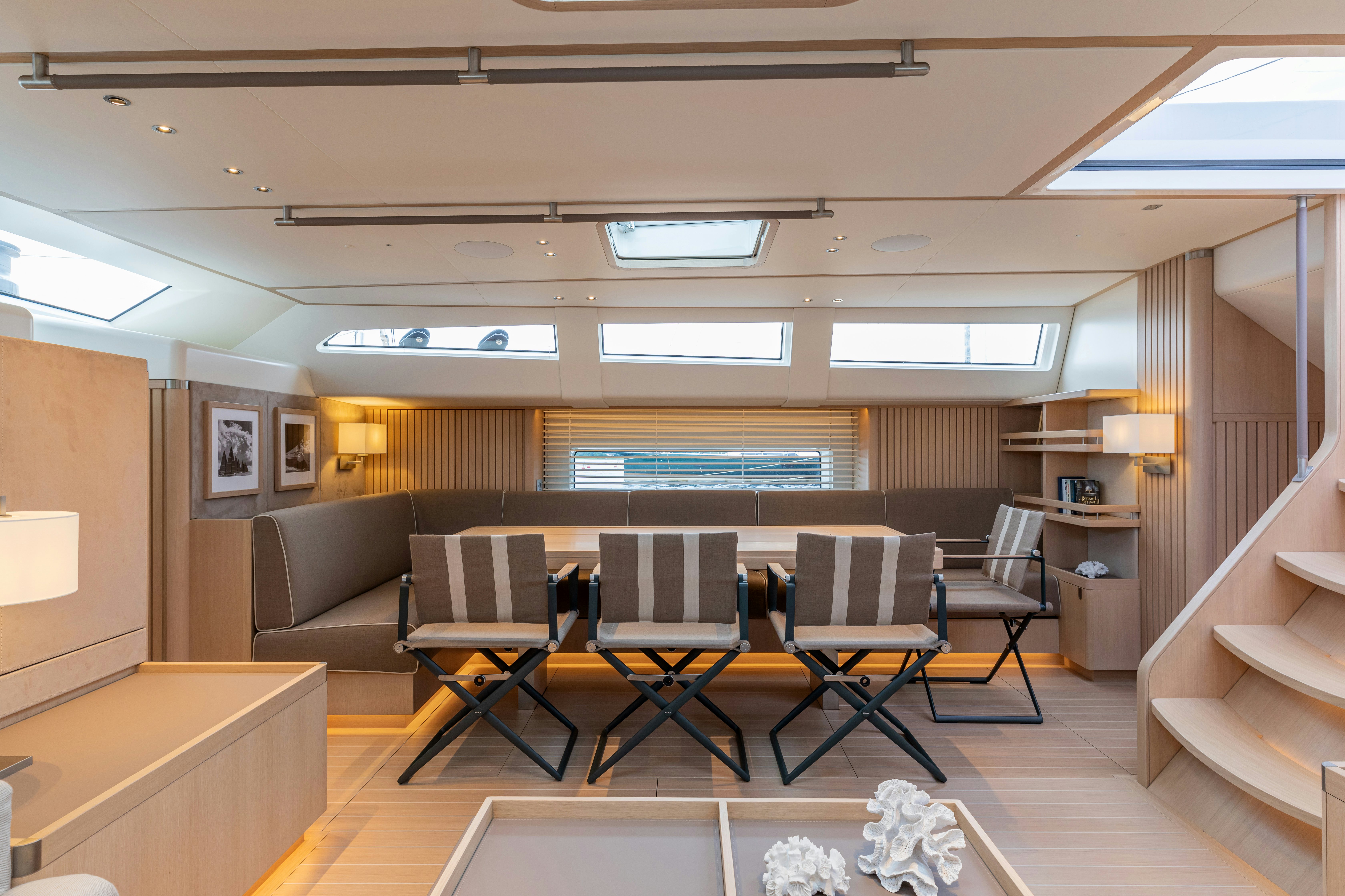 a room with a couch and chairs aboard ALIX Yacht for Sale