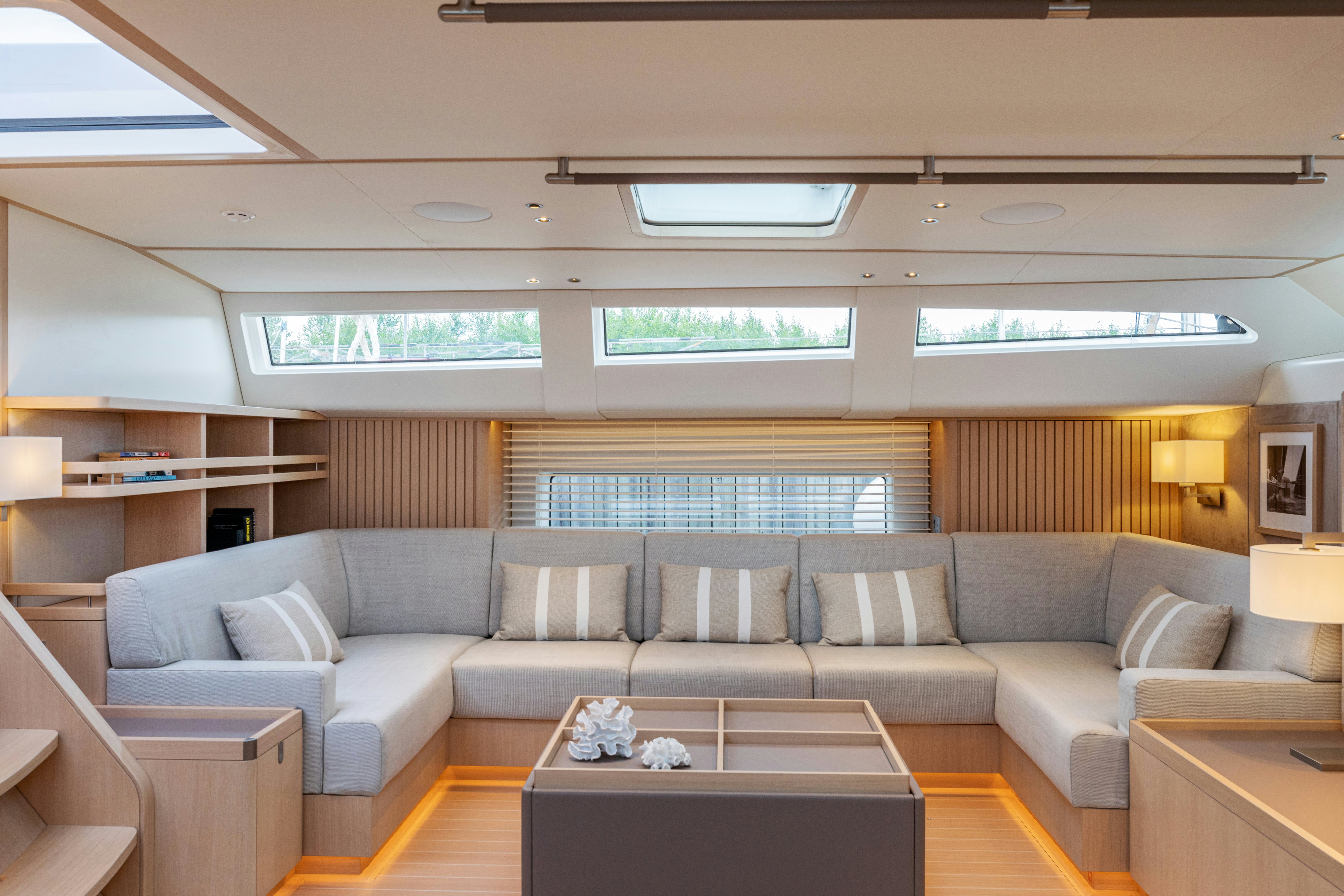 a living room with a couch and a table aboard ALIX Yacht for Sale