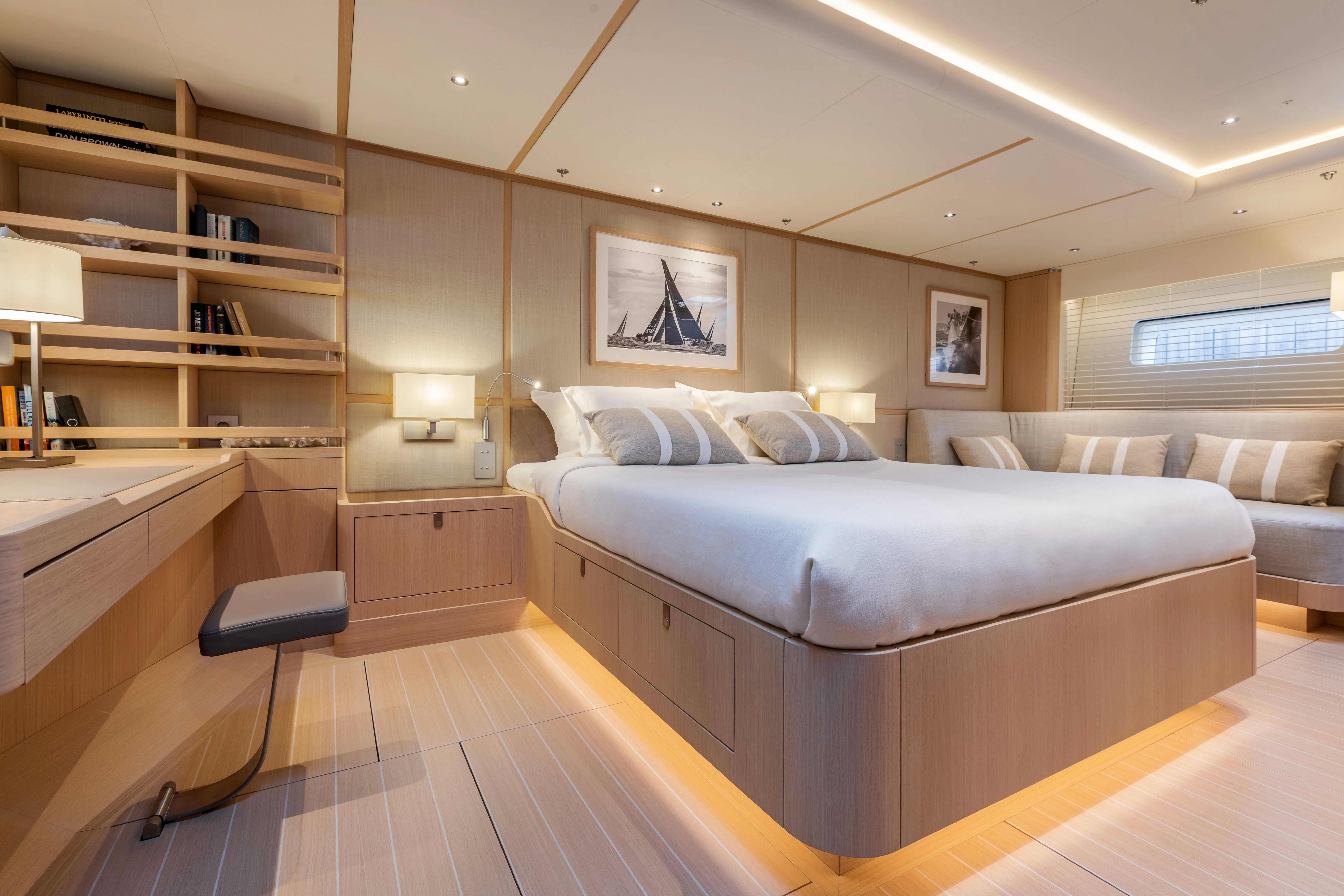 a bedroom with a bed and a desk aboard ALIX Yacht for Sale