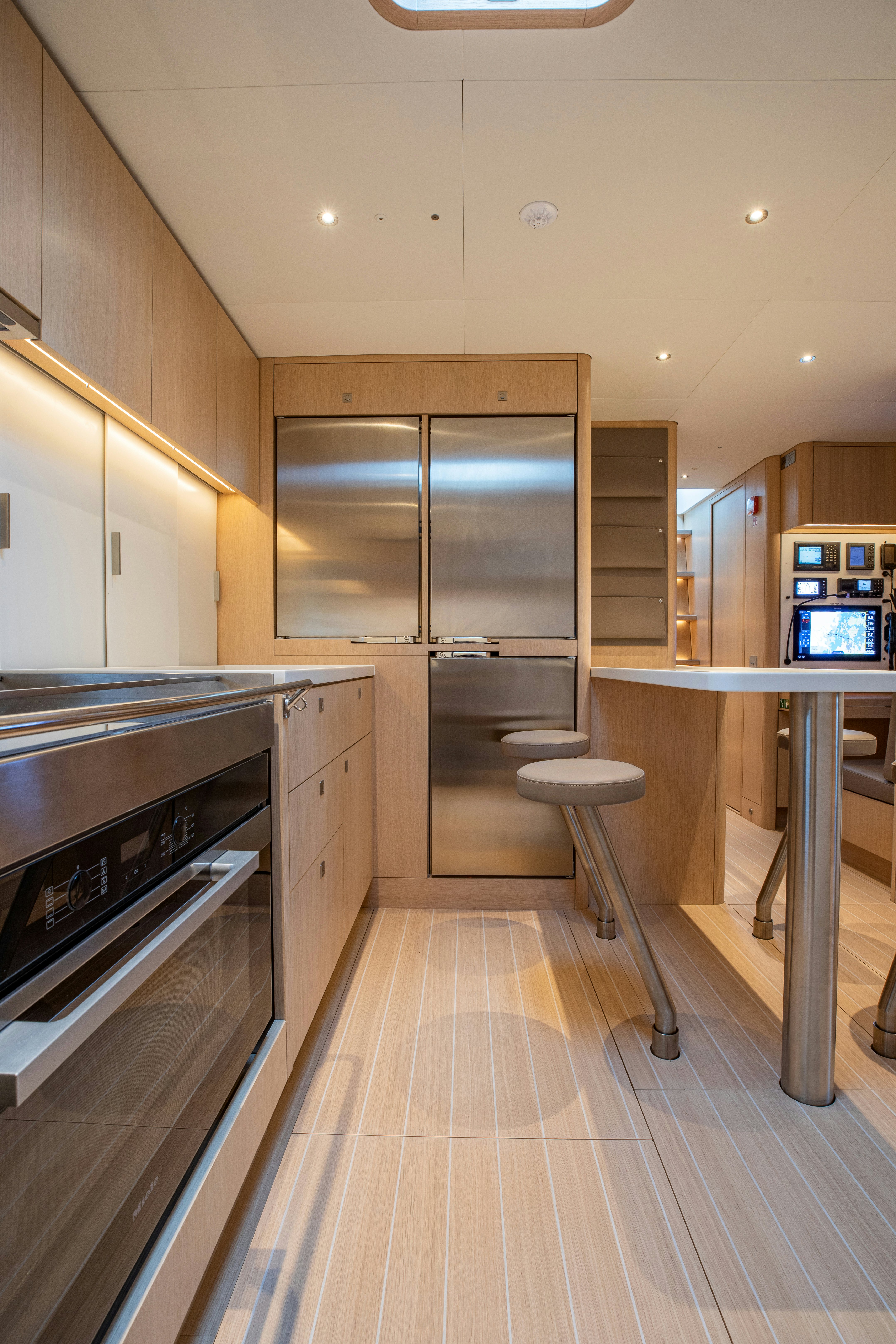 a kitchen with stainless steel appliances aboard ALIX Yacht for Sale