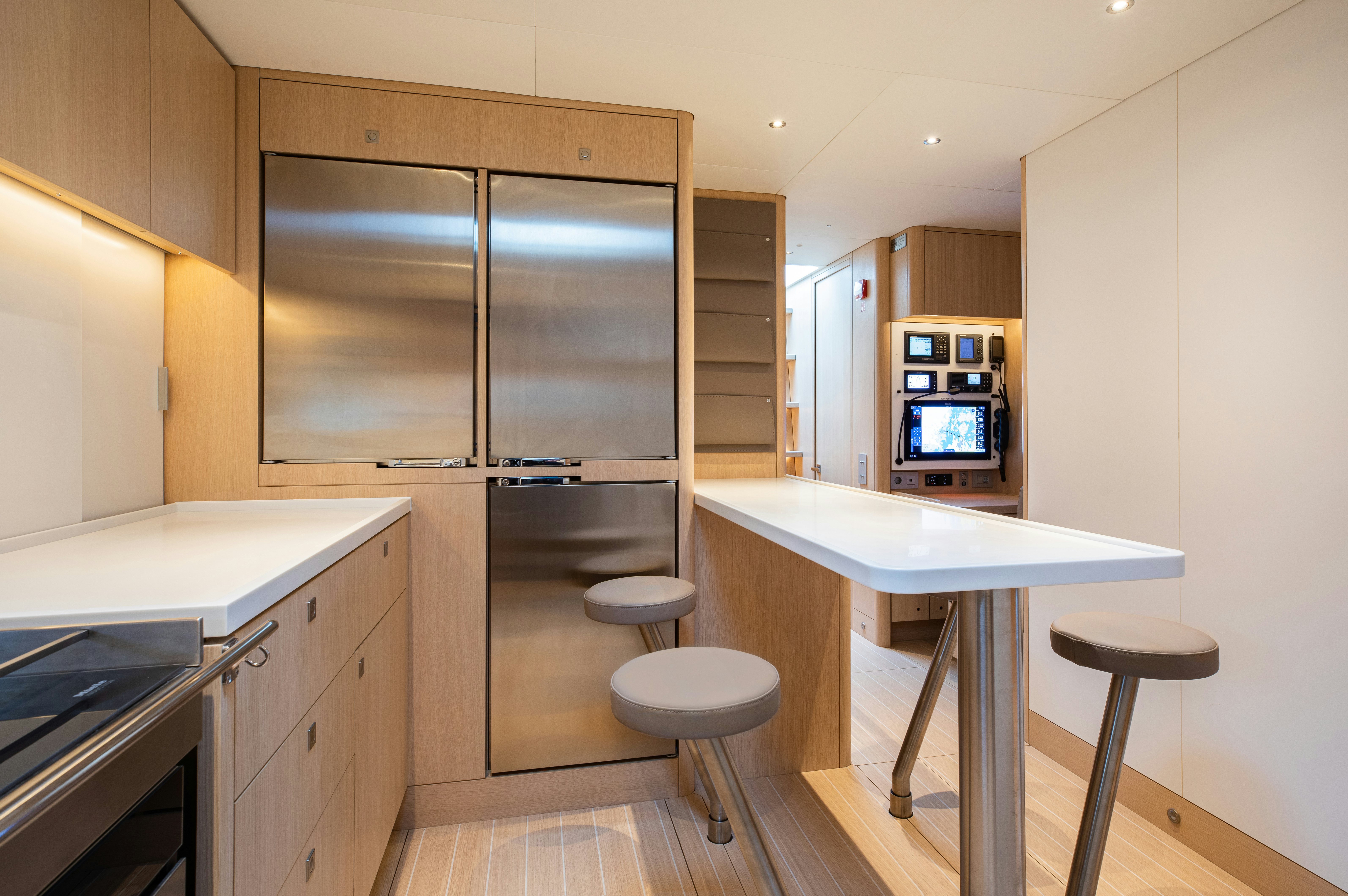 a kitchen with a refrigerator and a stove aboard ALIX Yacht for Sale