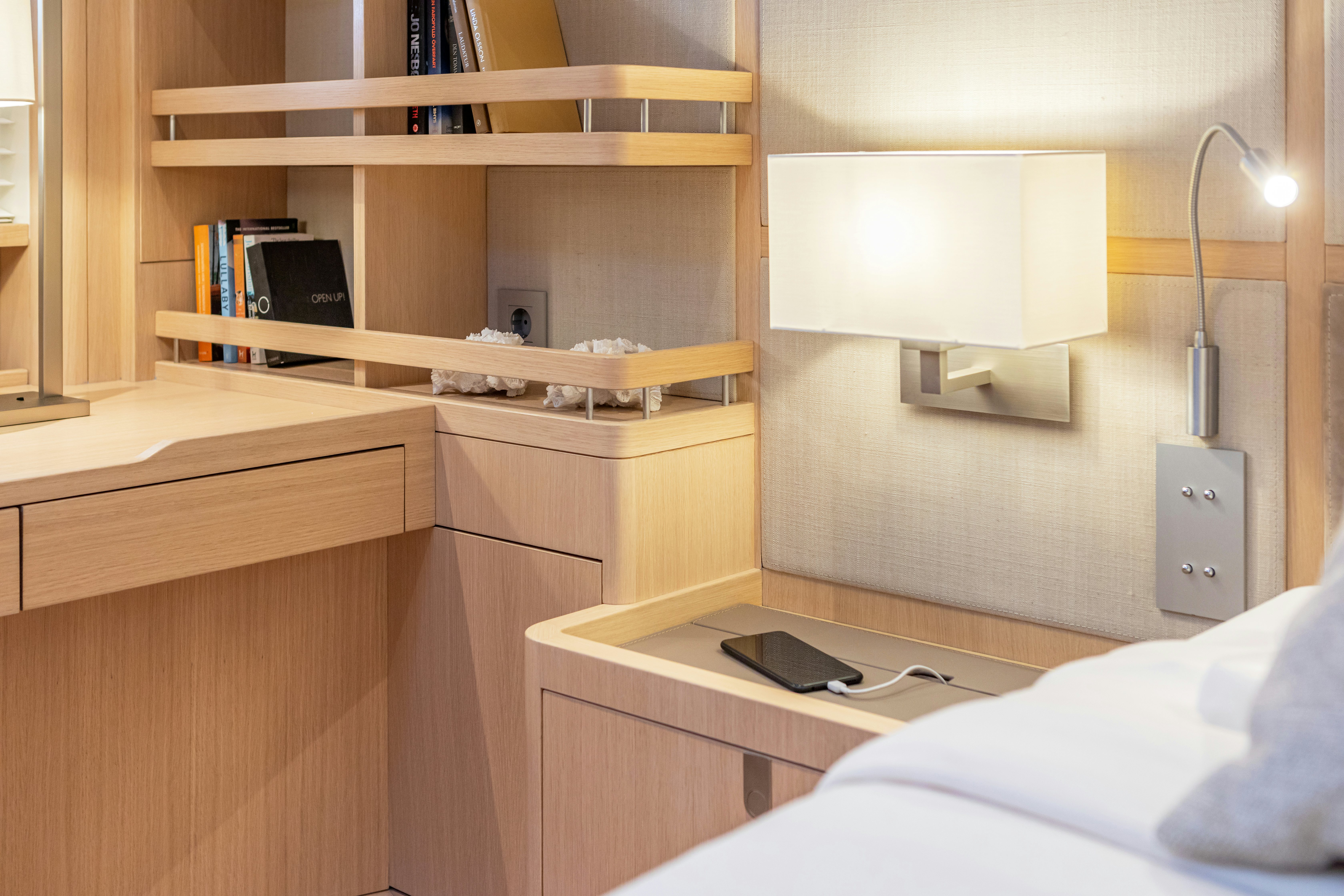 a desk with a laptop on it aboard ALIX Yacht for Sale