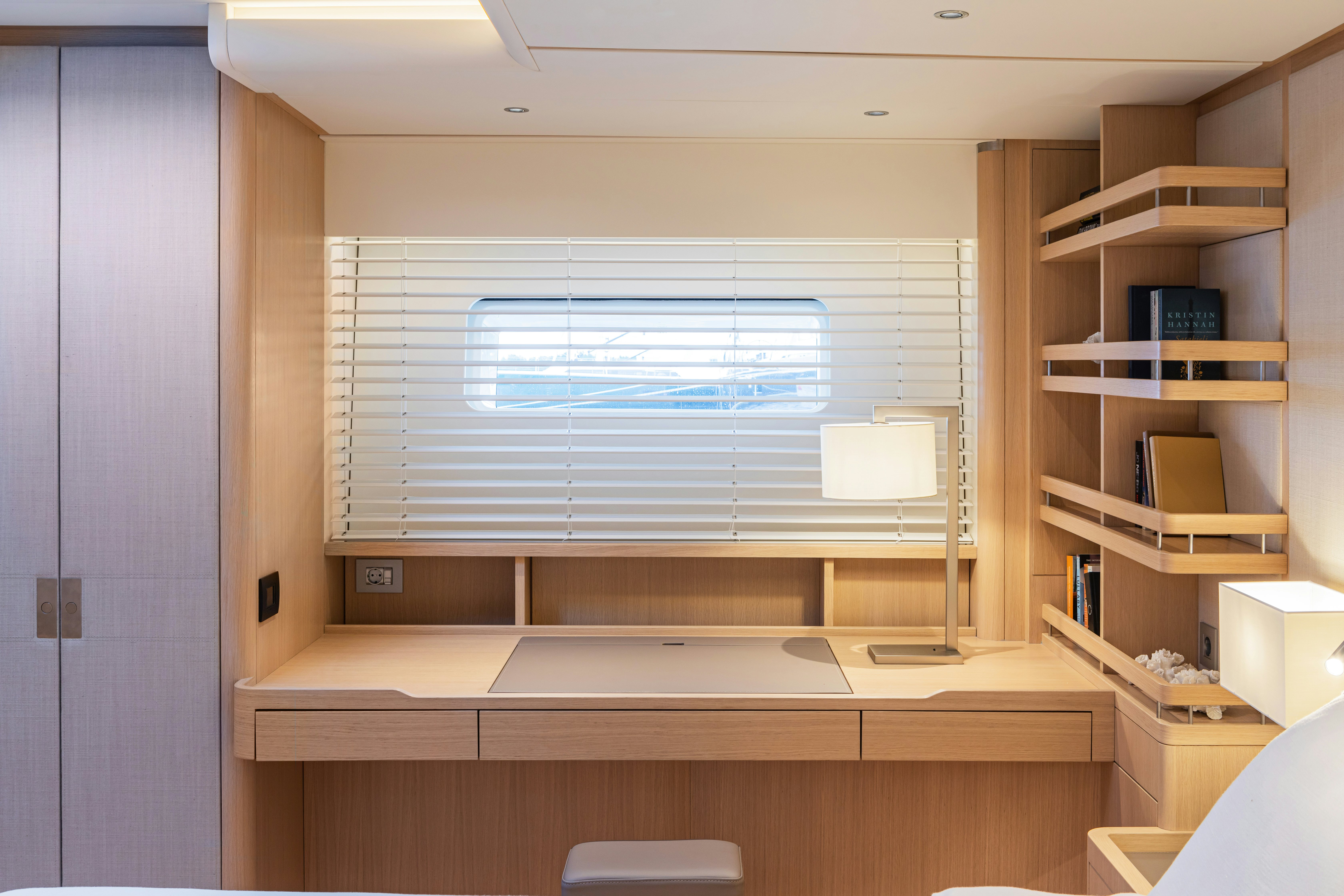 a room with a window and a bookcase aboard ALIX Yacht for Sale