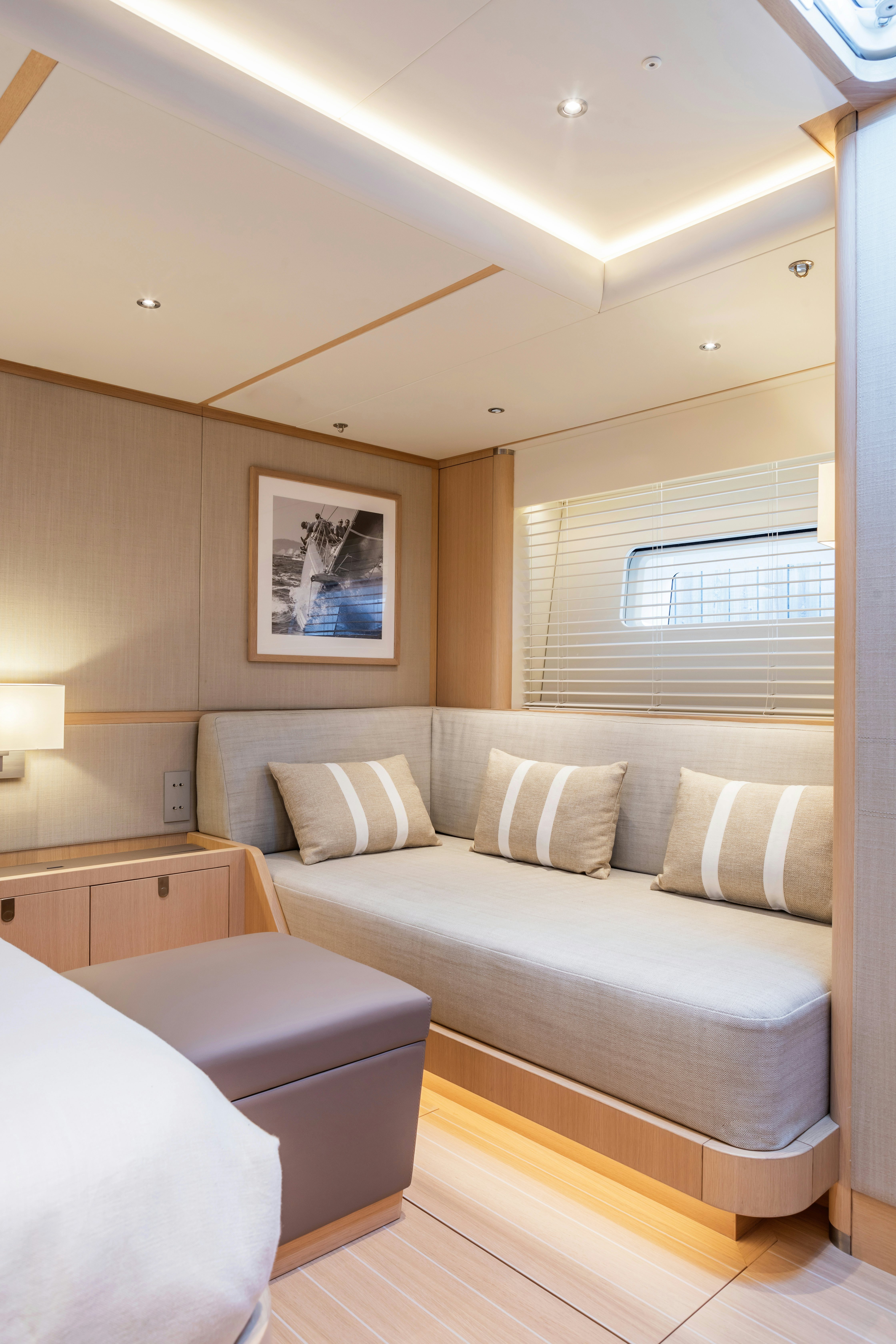 a bedroom with a bed and a window aboard ALIX Yacht for Sale