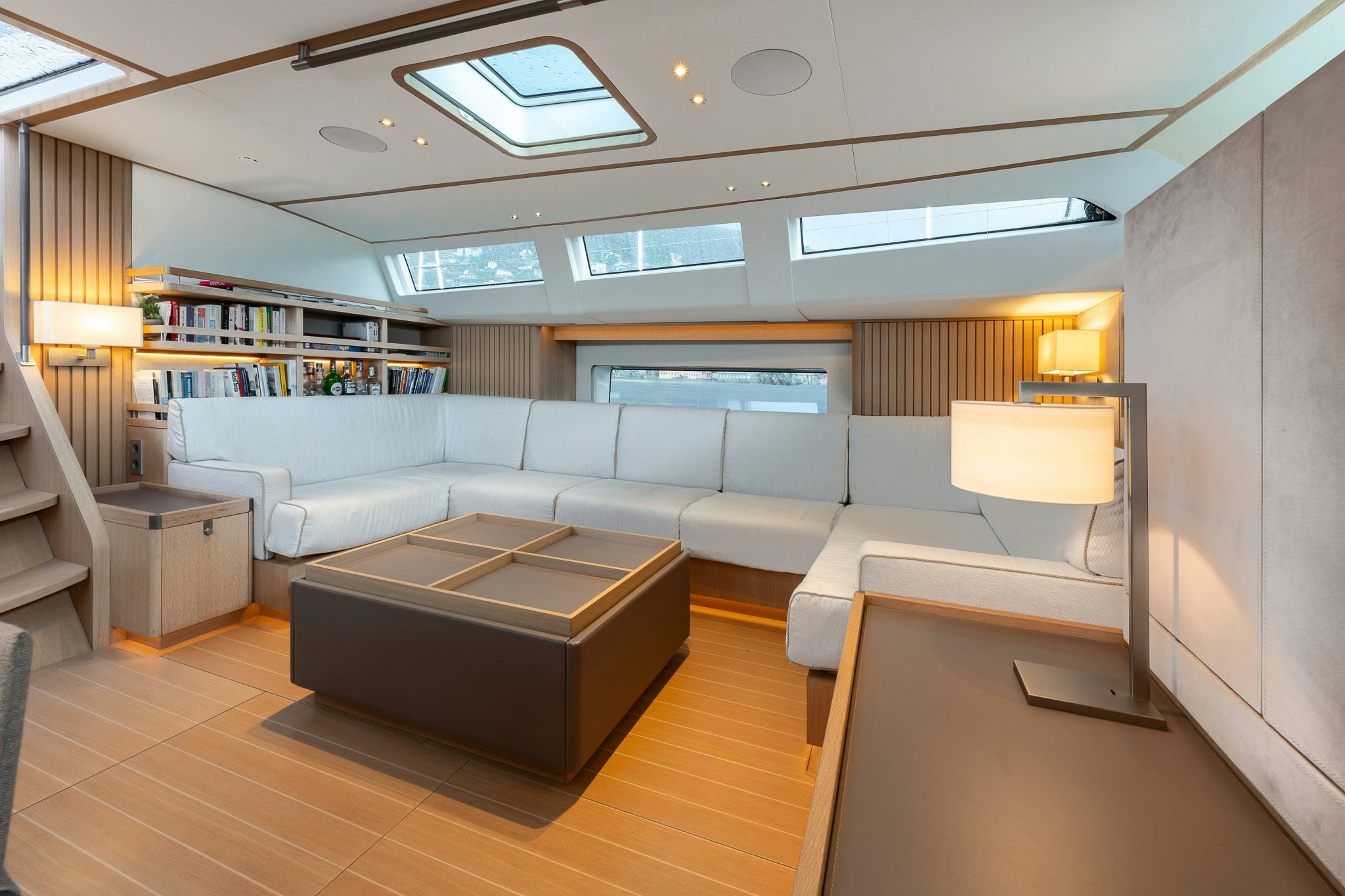 a living room with a couch and a table aboard ALIX Yacht for Sale
