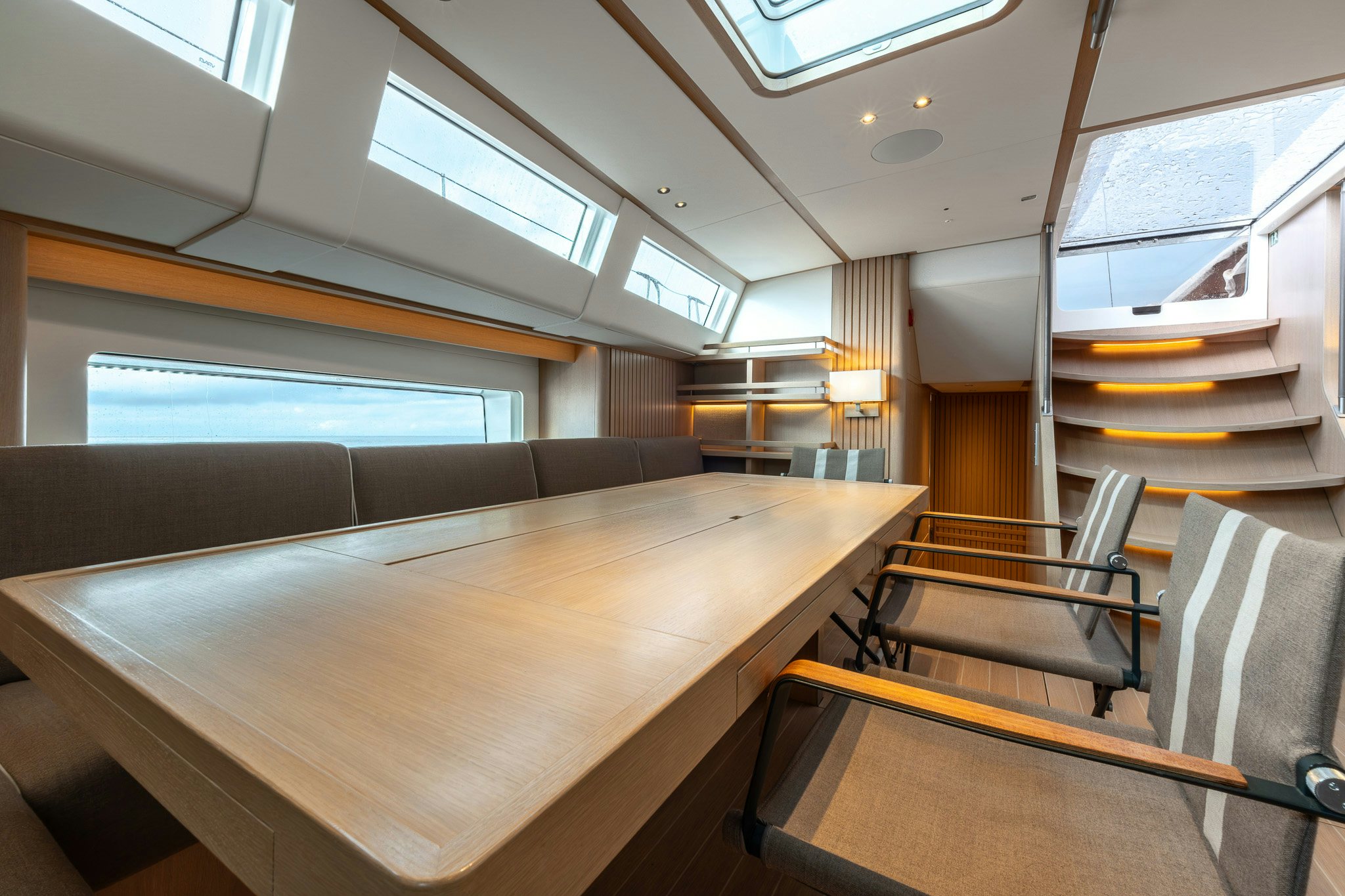 a room with a table and chairs aboard ALIX Yacht for Sale