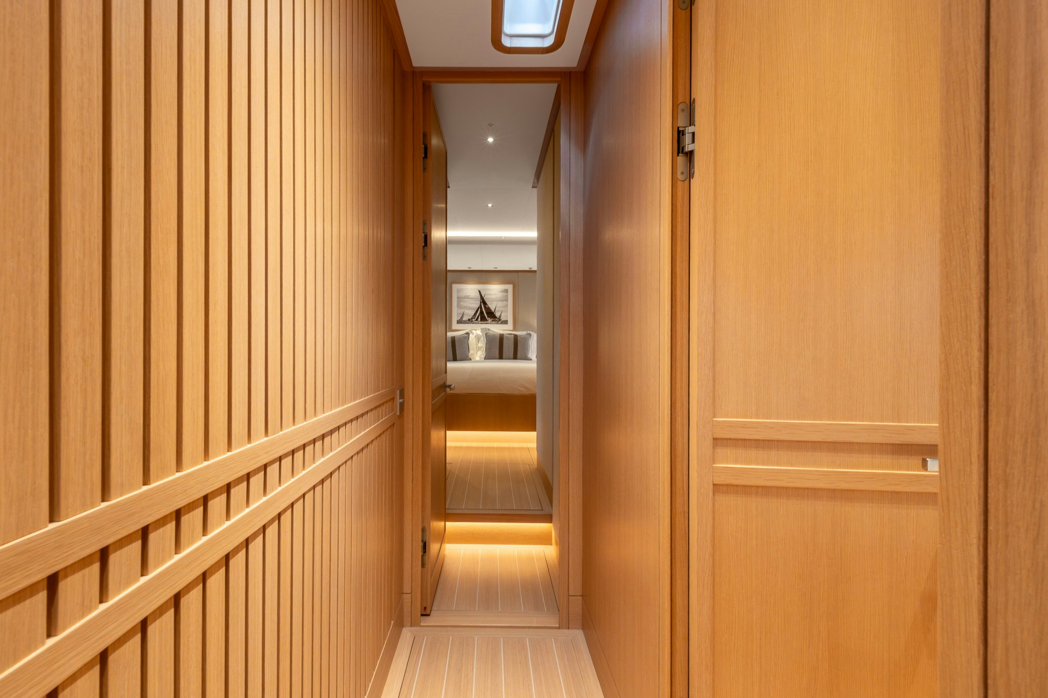 a hallway with wooden doors aboard ALIX Yacht for Sale