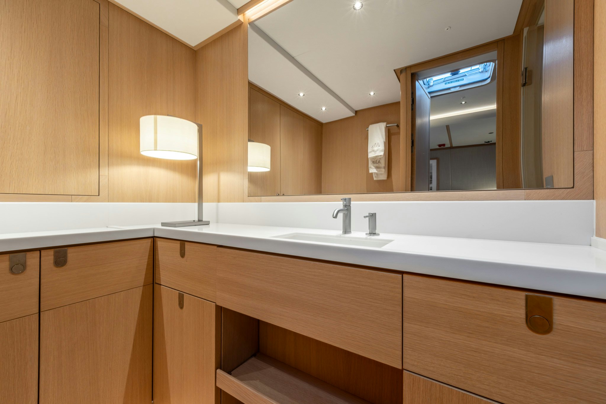 a bathroom with a large mirror aboard ALIX Yacht for Sale