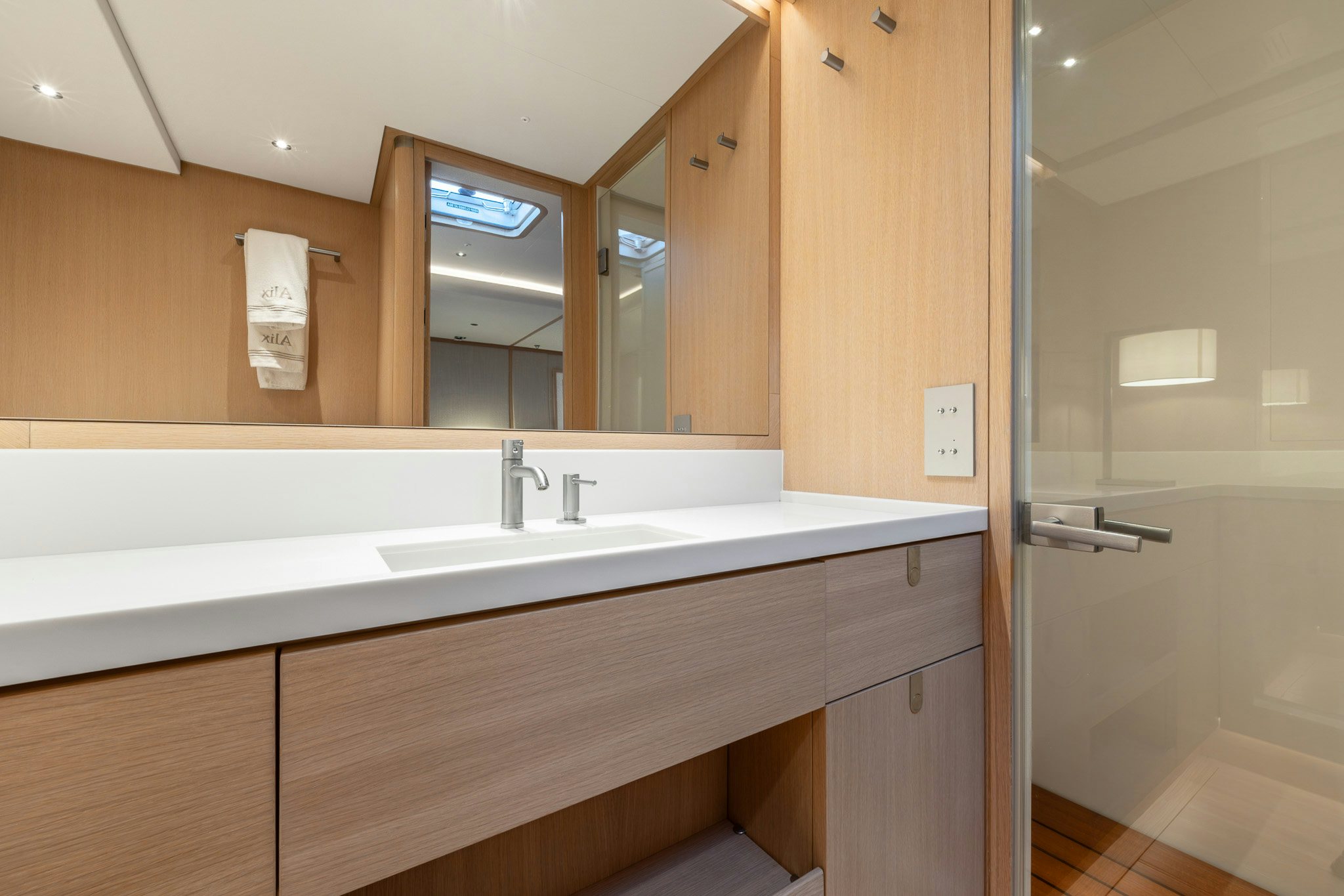 a bathroom with a large mirror aboard ALIX Yacht for Sale