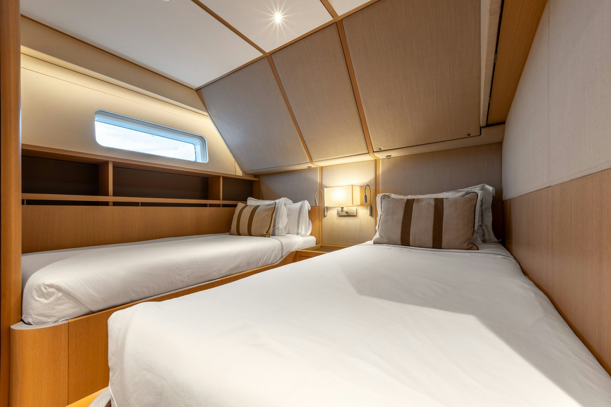 a room with a bed and a window aboard ALIX Yacht for Sale