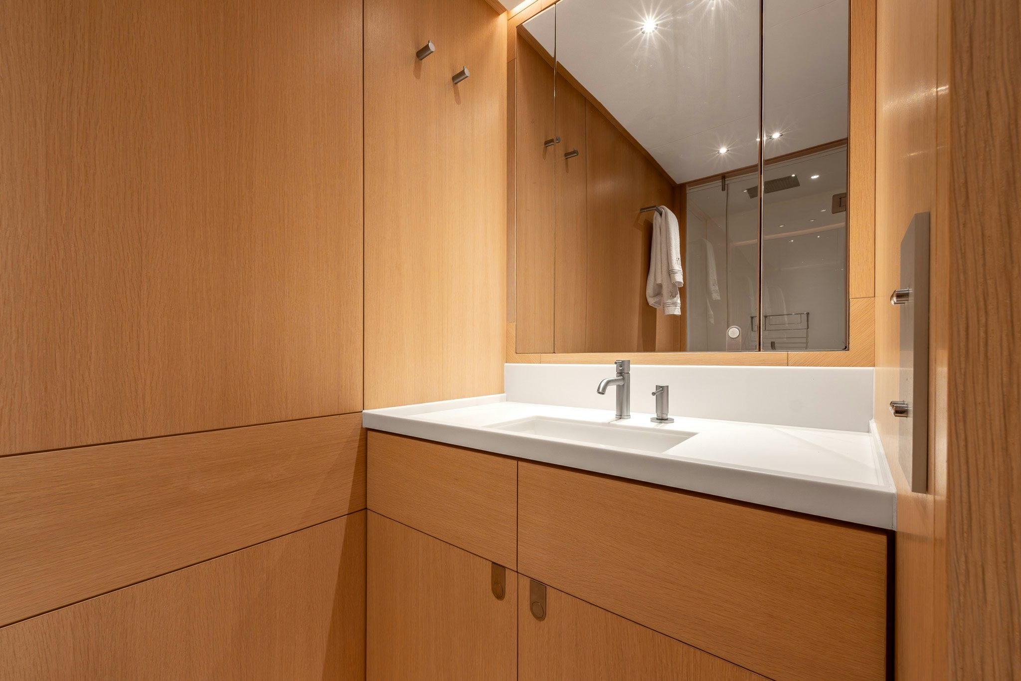 a bathroom with a large mirror aboard ALIX Yacht for Sale
