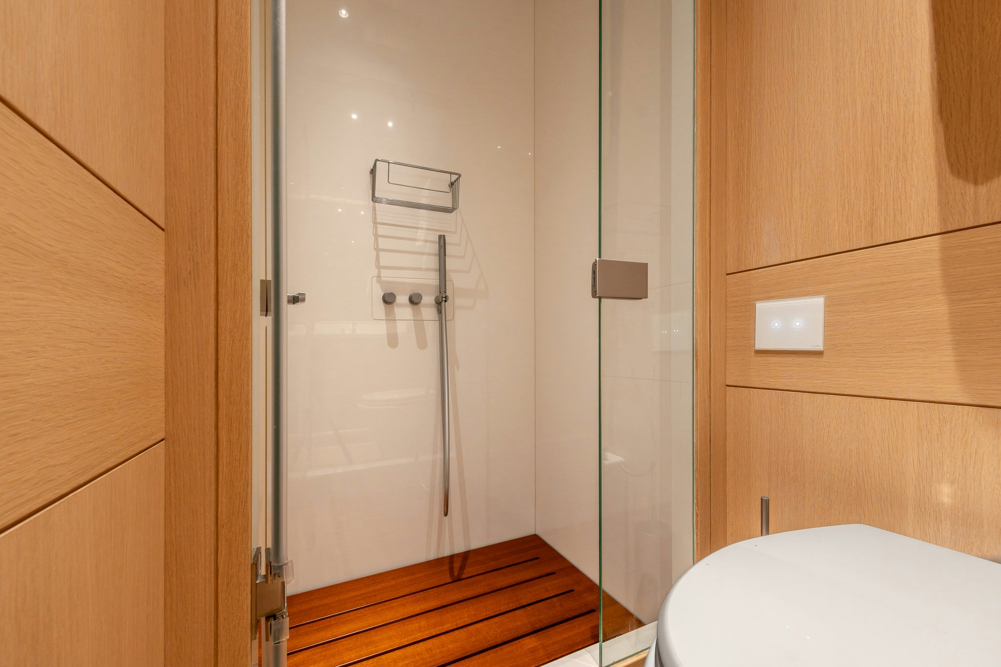 a bathroom with a glass shower aboard ALIX Yacht for Sale