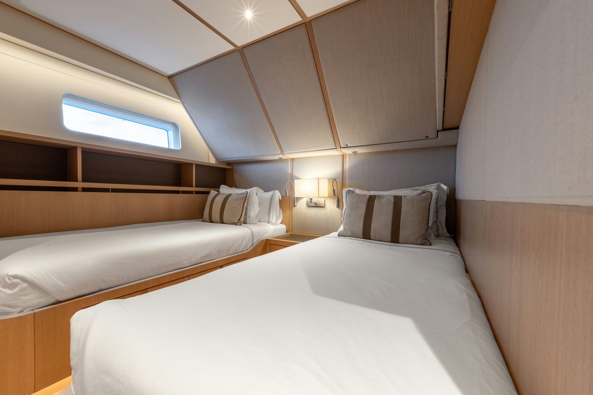 a room with a bed and a window aboard ALIX Yacht for Sale